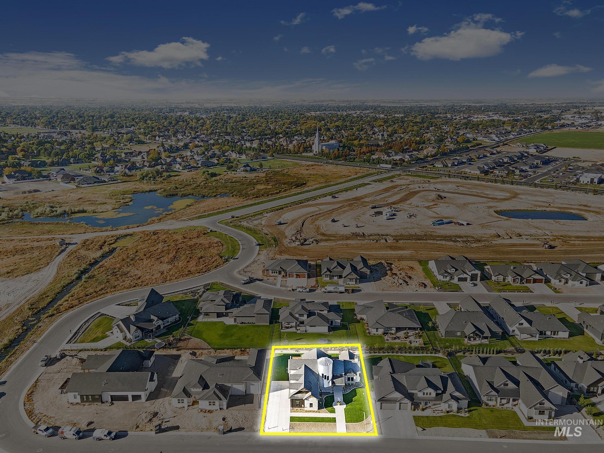 Aerial view of residential area featuring property boundaries highlighted