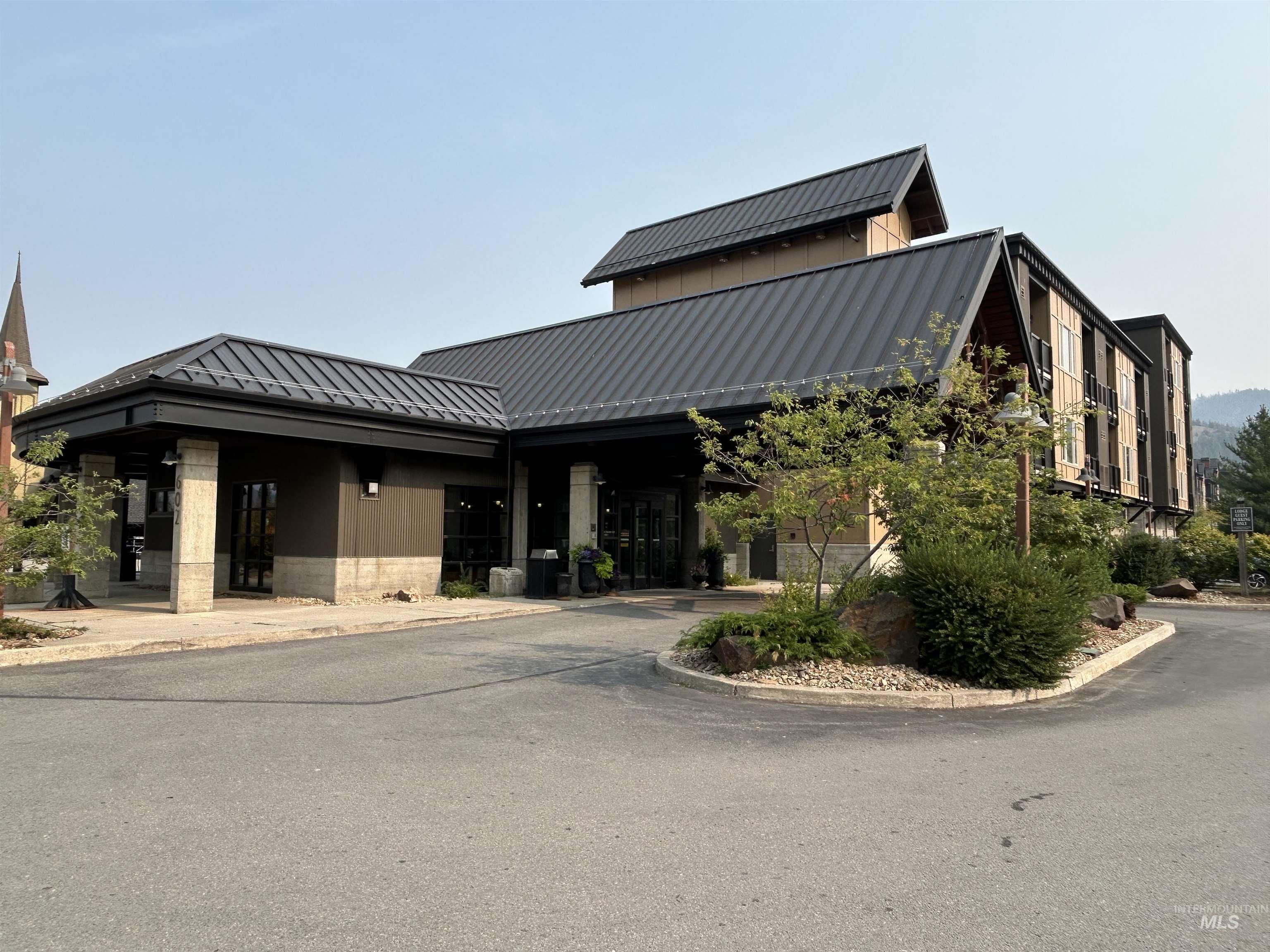View of front of house with a standing seam roof and a metal roof