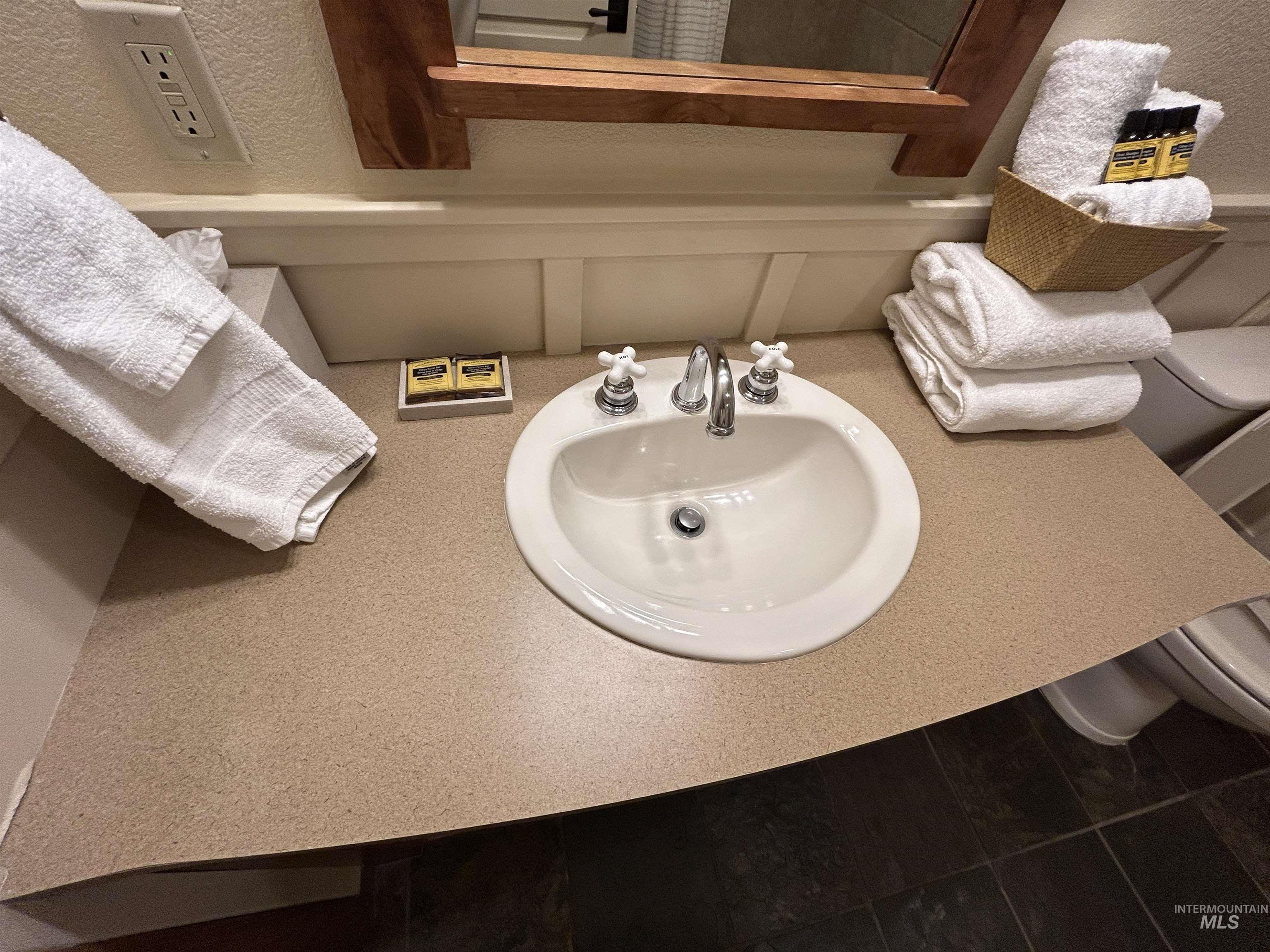 Bathroom with a sink and tile patterned floors
