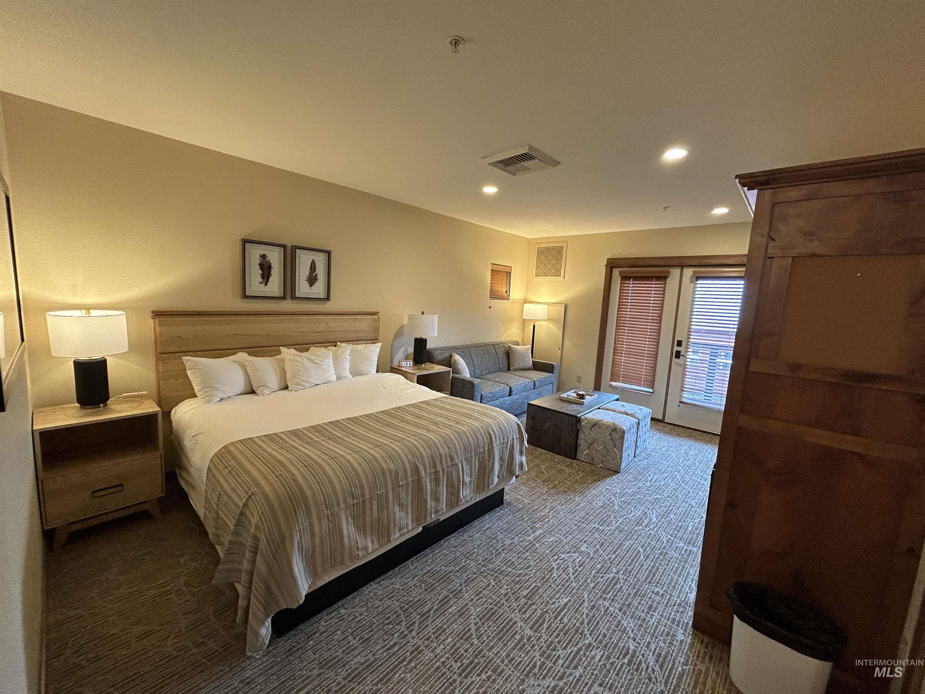 Bedroom with french doors, access to exterior, carpet, and recessed lighting