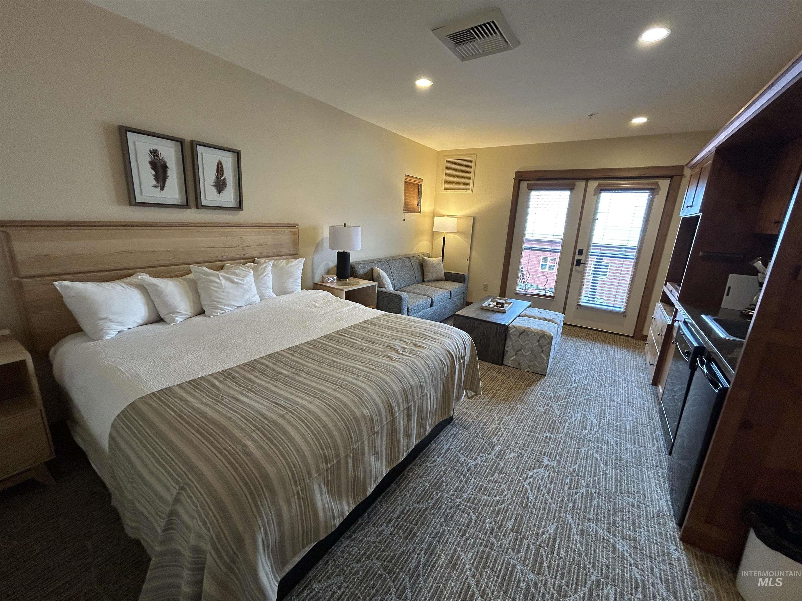 Bedroom featuring french doors, access to outside, carpet, and recessed lighting