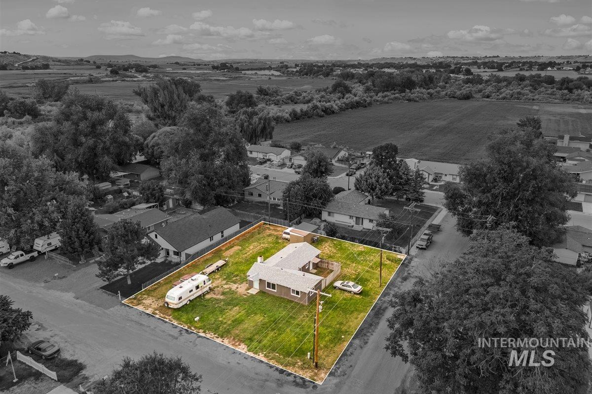 Aerial view of residential area featuring property boundaries highlighted
