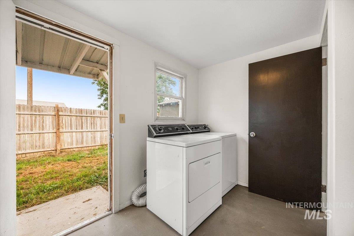 Laundry area featuring washing machine and clothes dryer