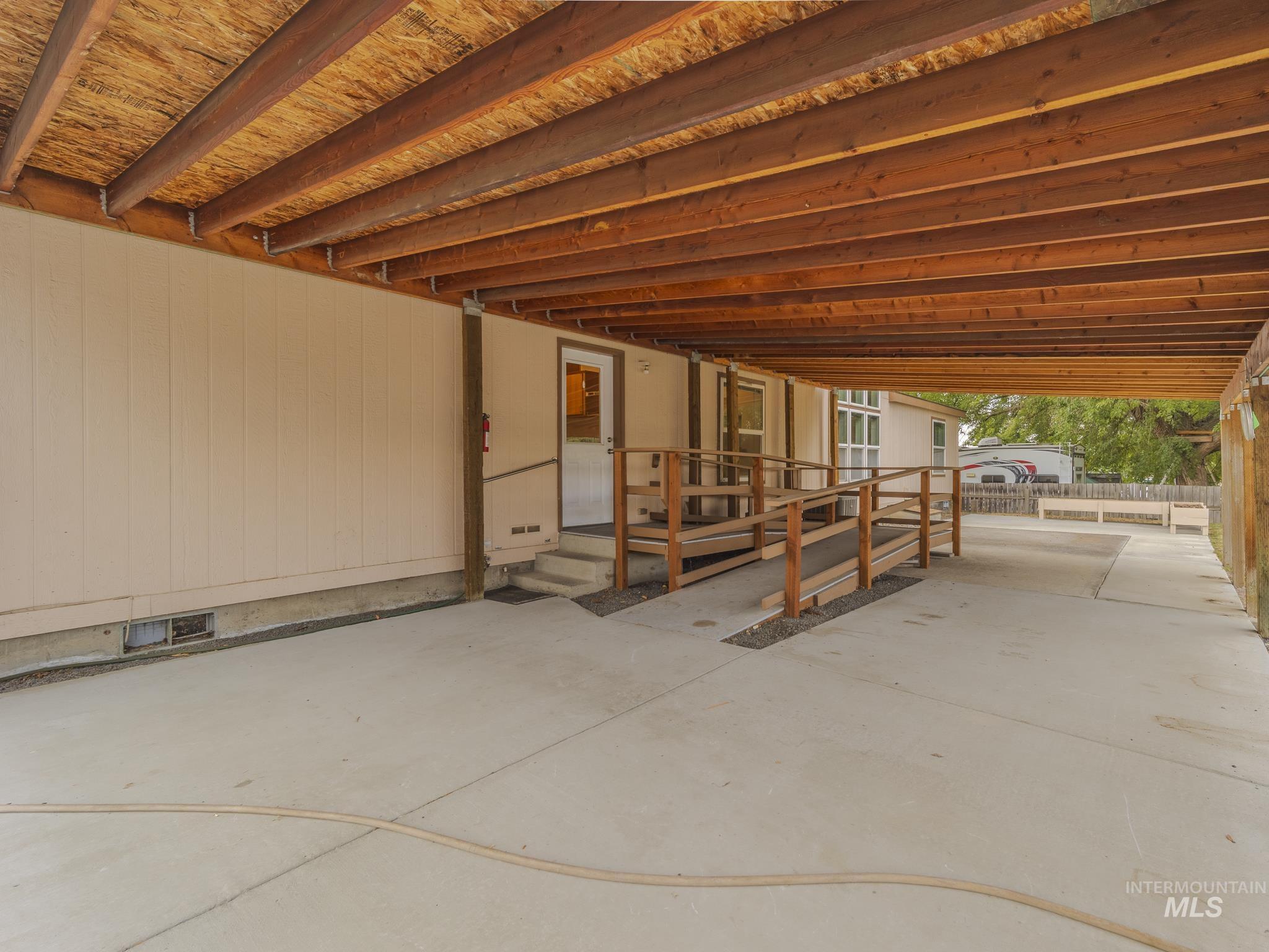 View of patio with a carport