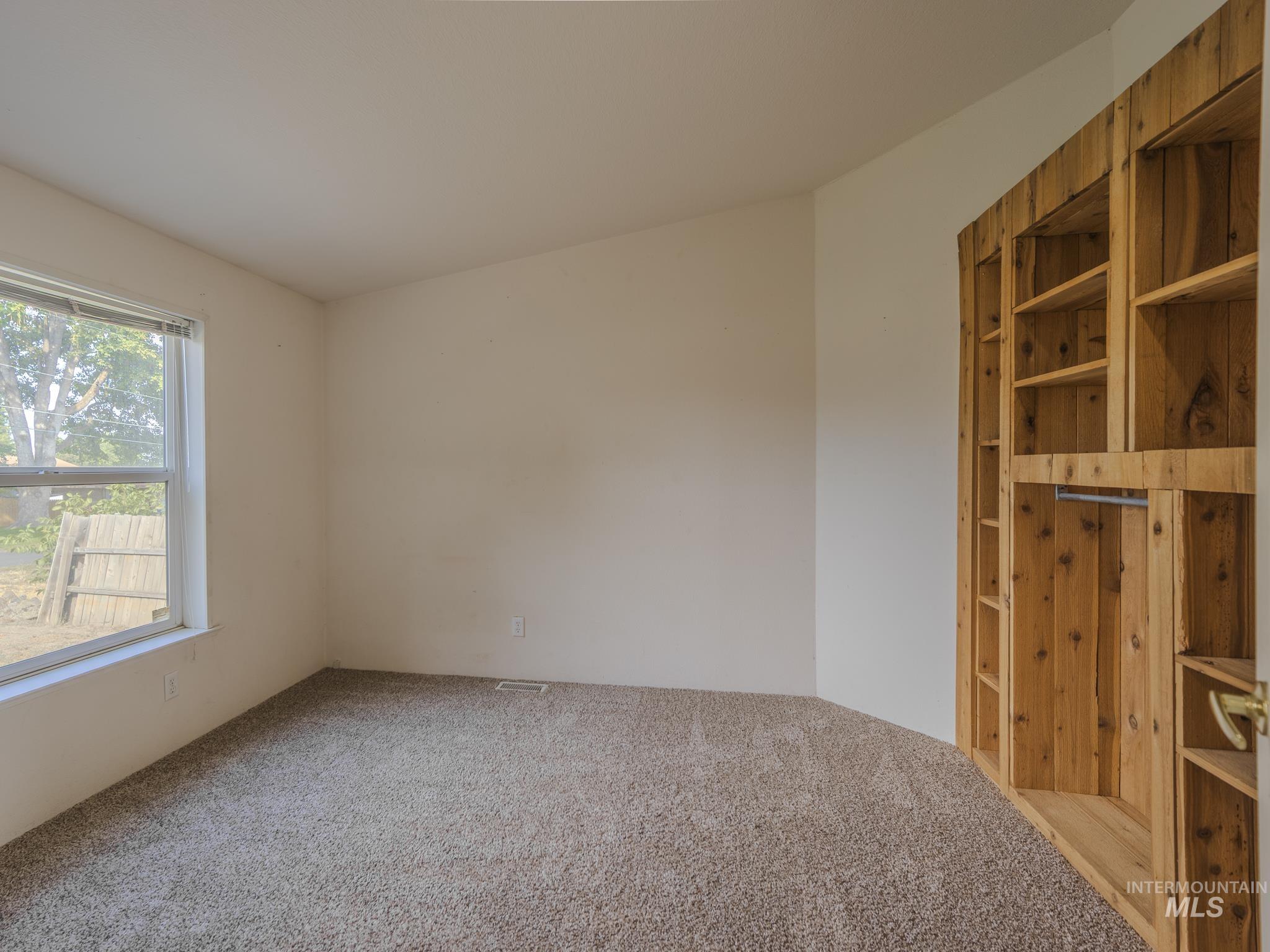 Unfurnished bedroom featuring carpet