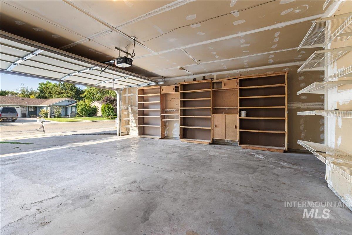 Garage featuring a garage door opener