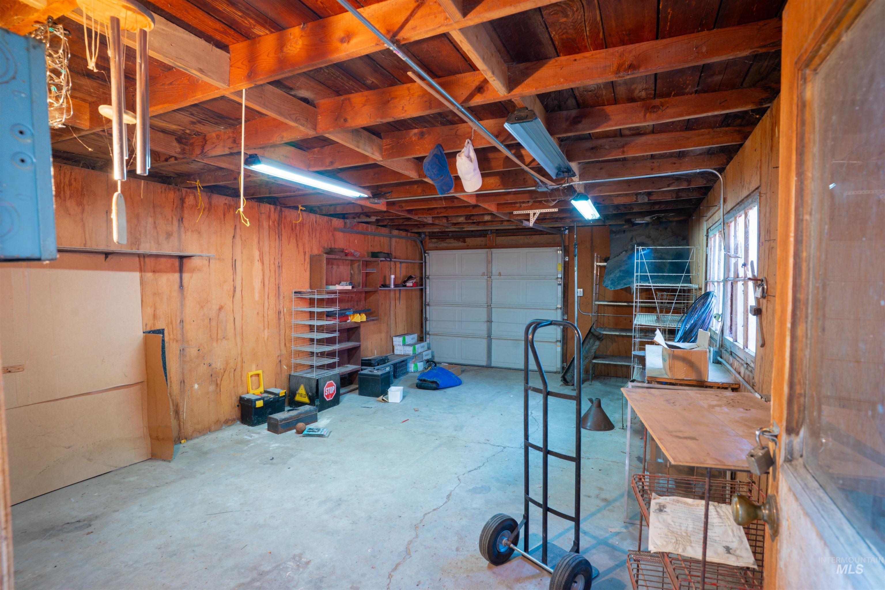 Garage featuring wooden walls