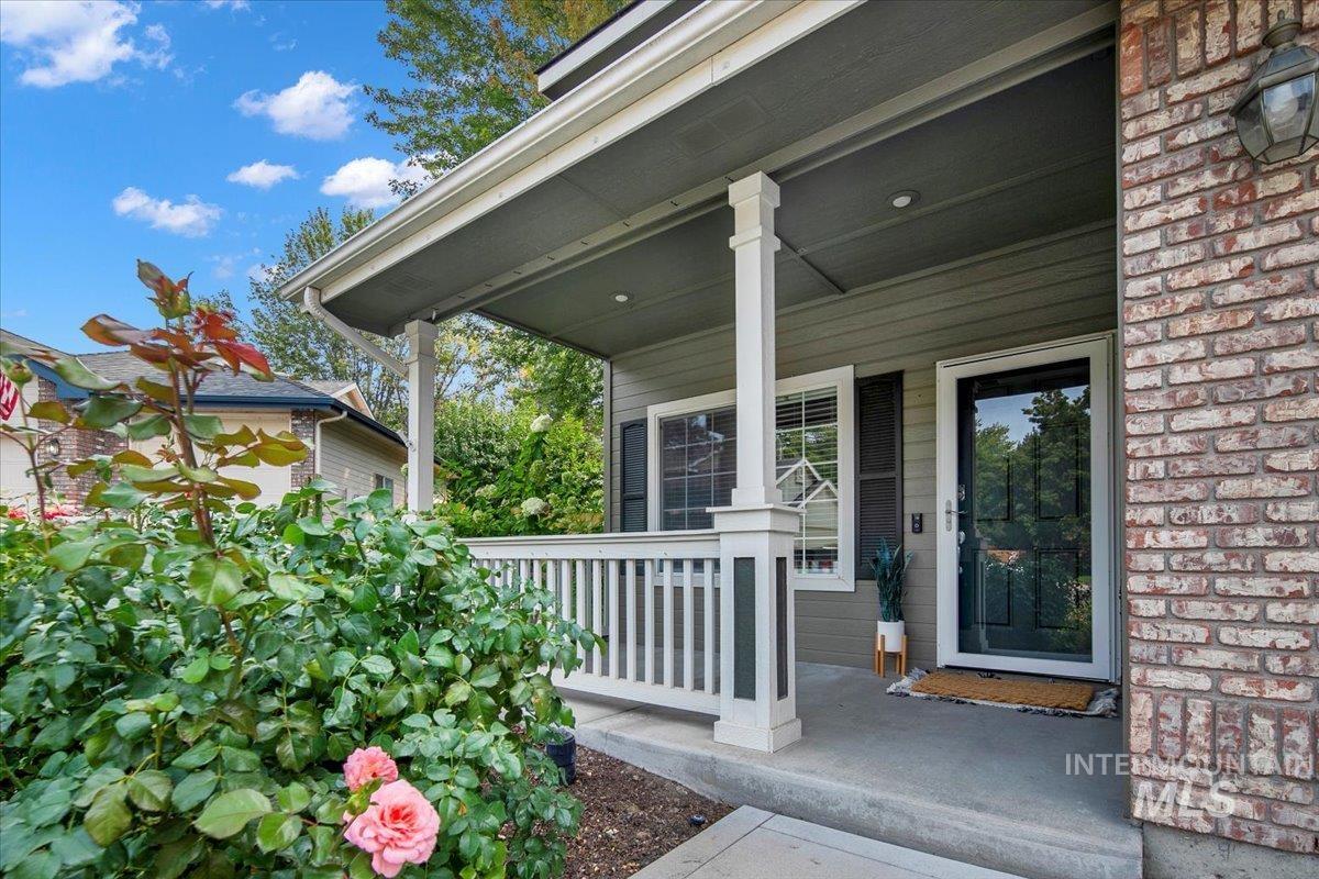 Doorway to property featuring a porch
