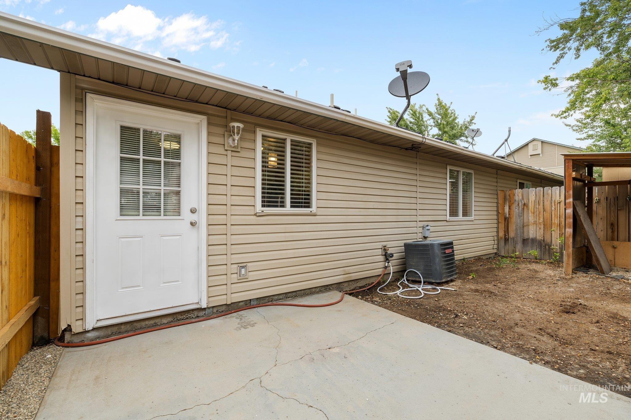 Rear view of property featuring a patio area