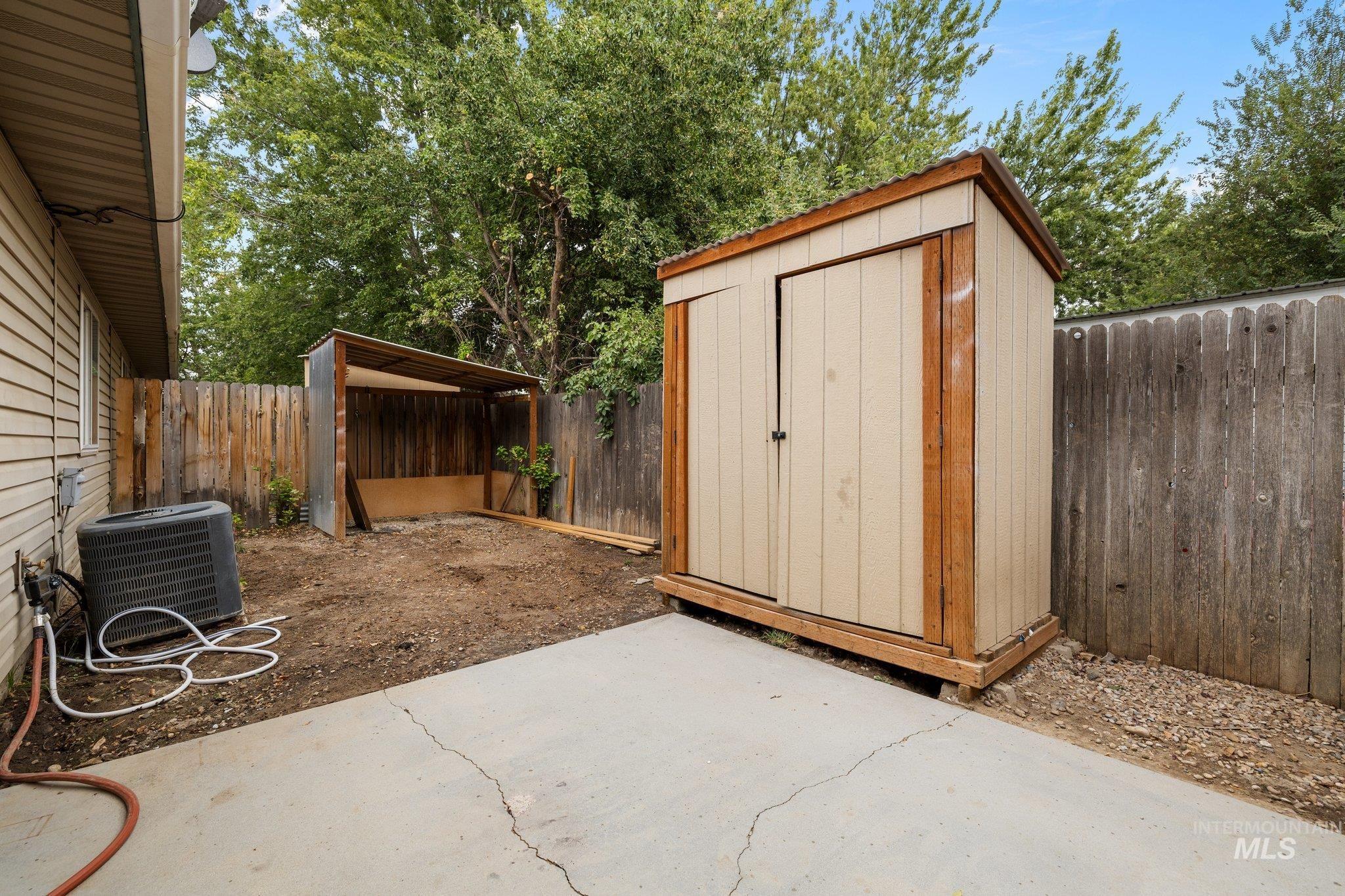View of shed featuring a fenced backyard