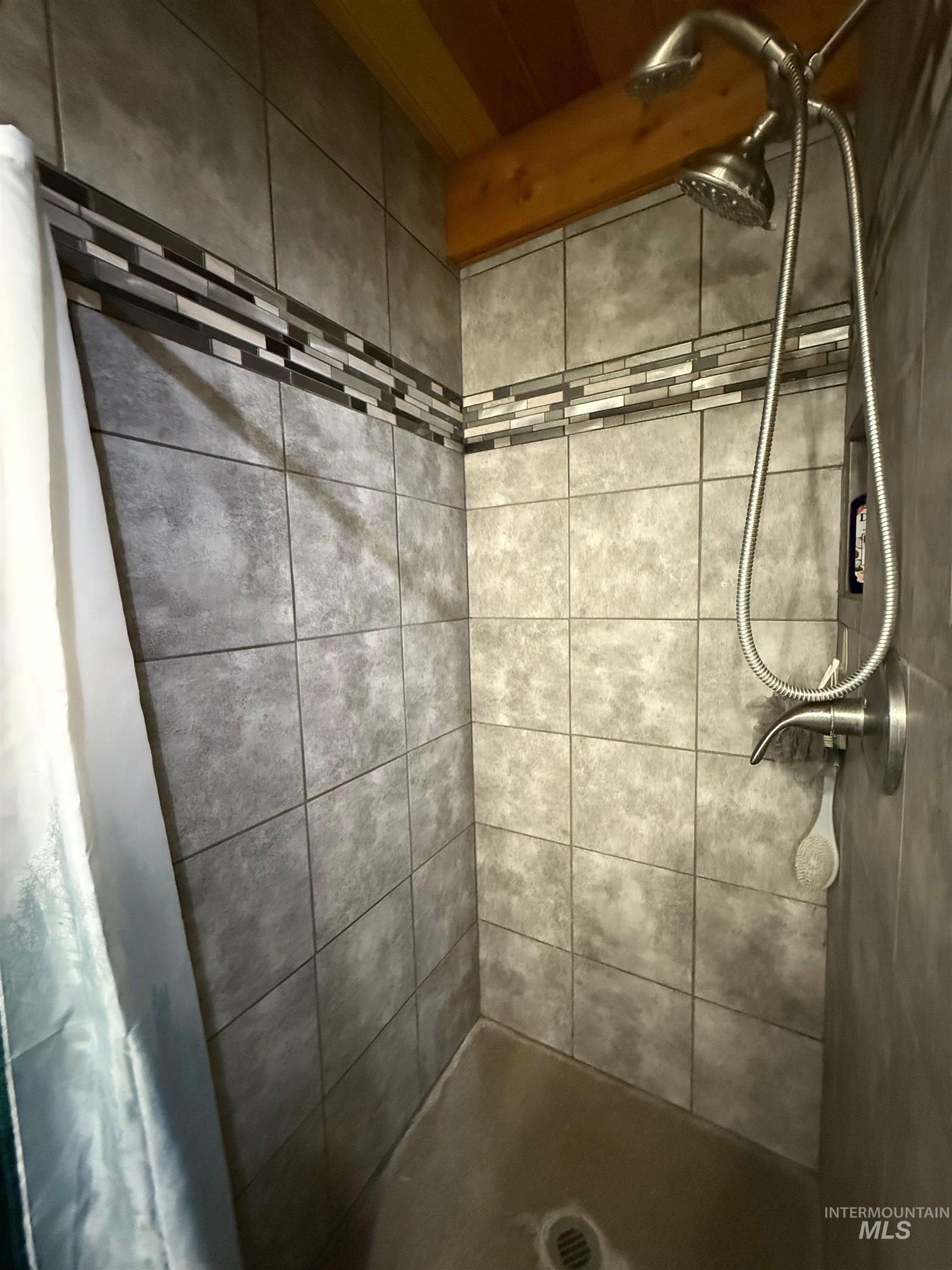 Full bathroom featuring a stall shower