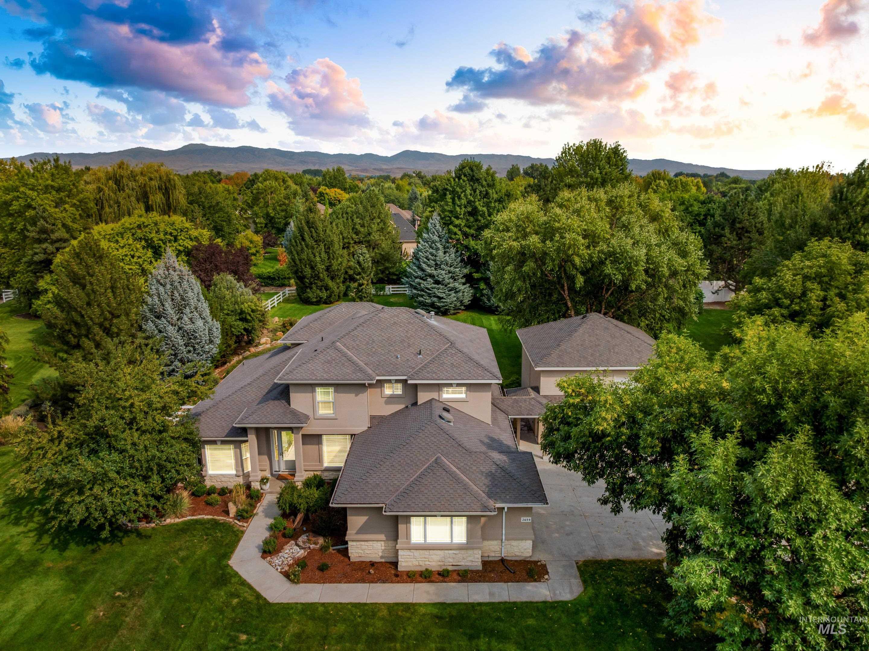 View of subject property featuring a mountain backdrop