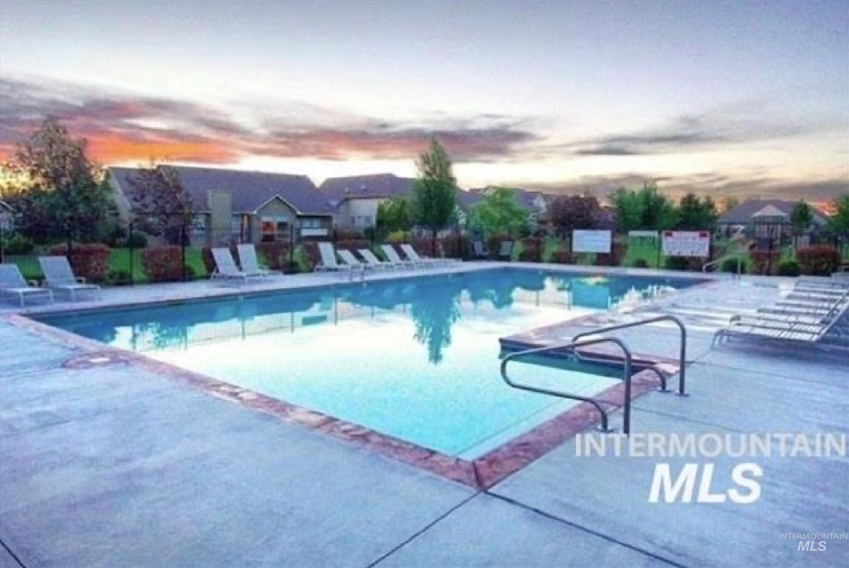 Community pool featuring a patio area