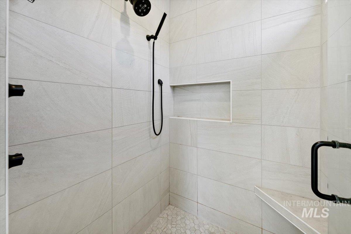 Full bath featuring a stall shower