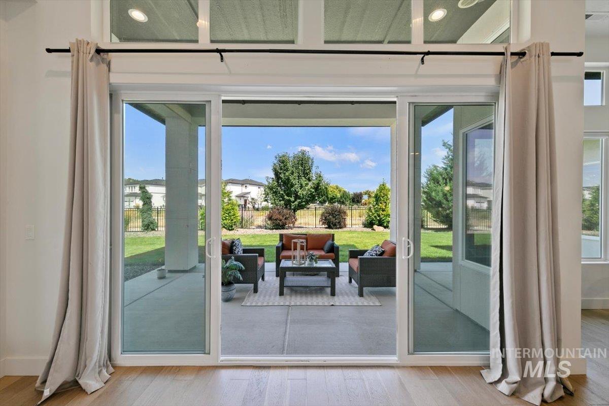 Entryway with wood finished floors and french doors