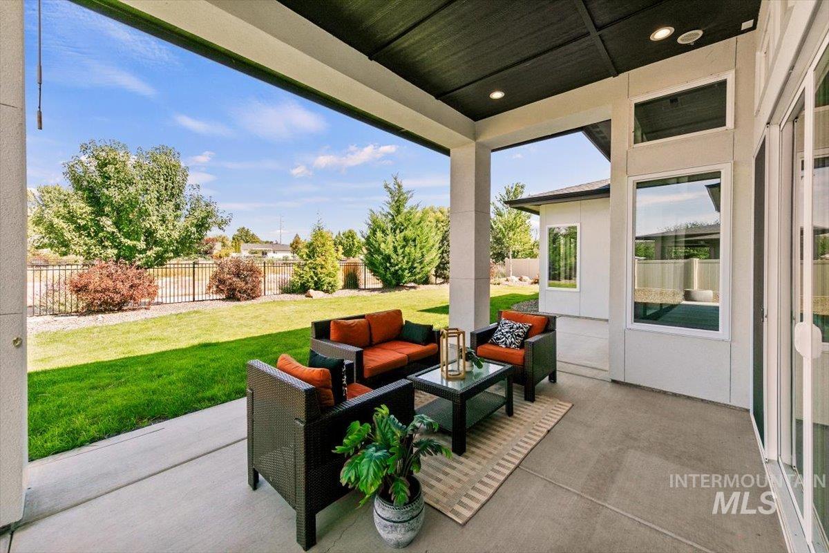 Fenced backyard featuring a patio and outdoor lounge area