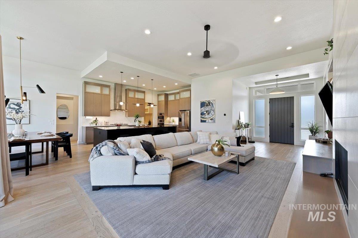 Living area featuring recessed lighting and light wood-style floors