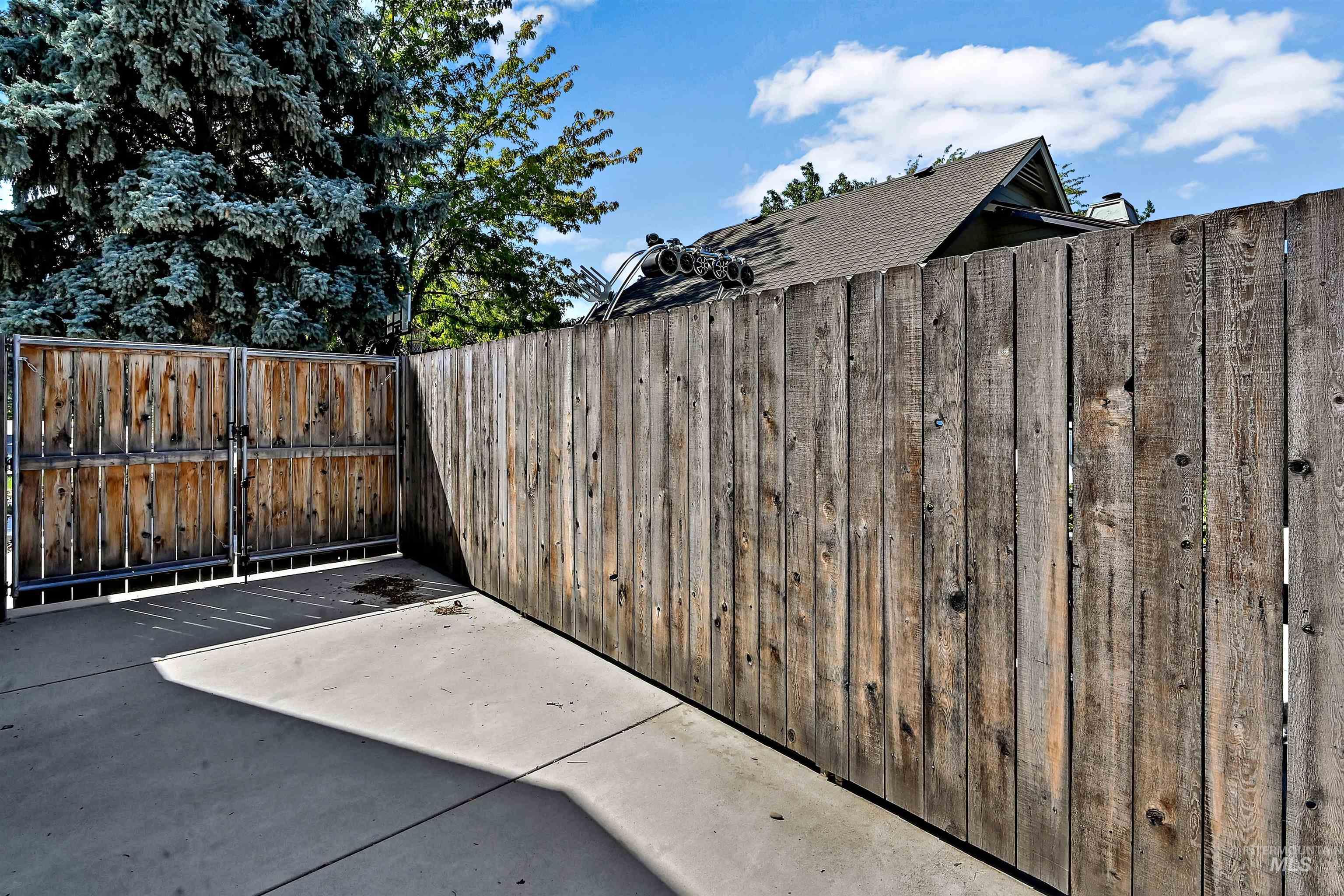 View of patio featuring a gate