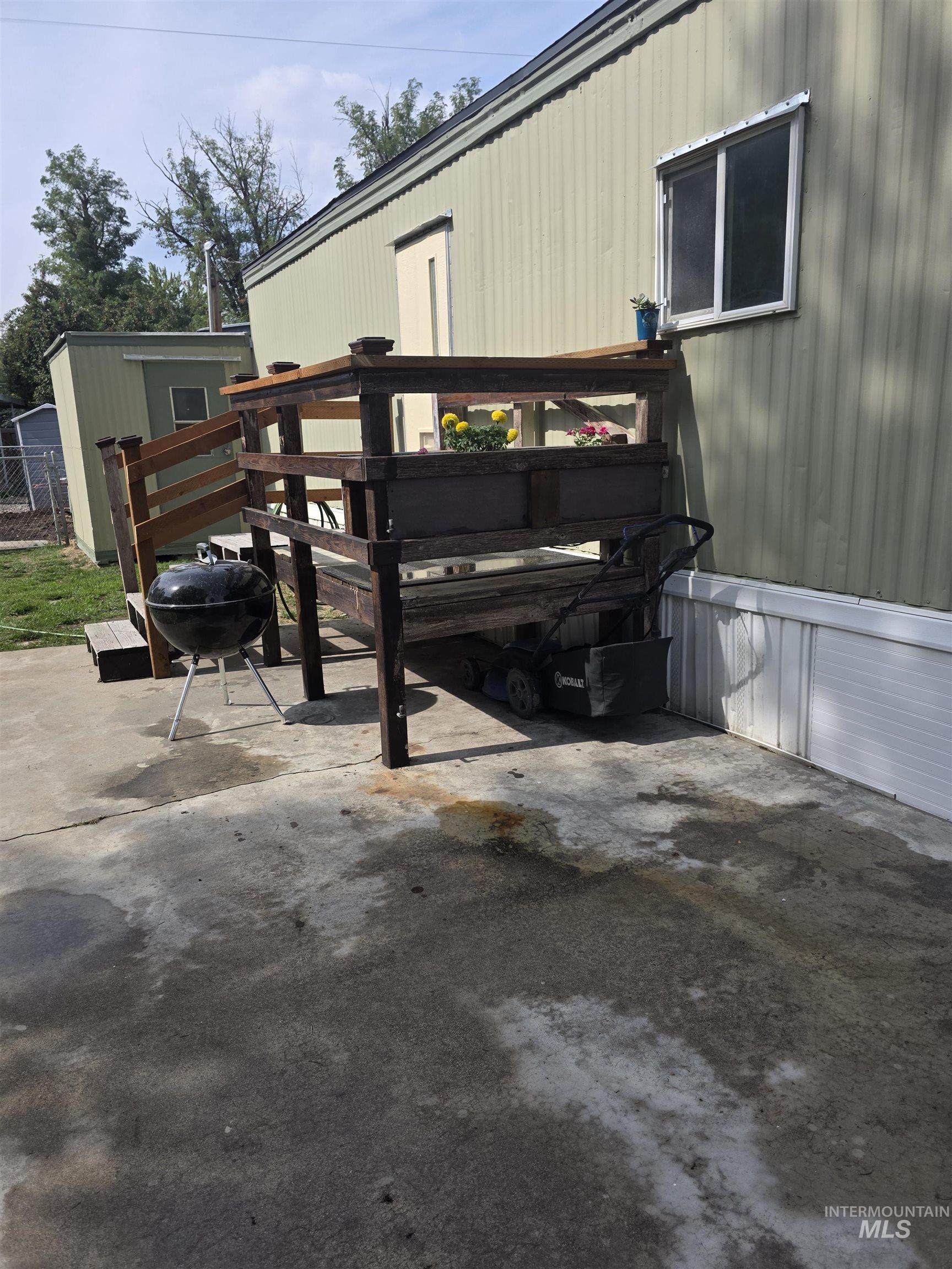 View of vehicle parking with a fire pit