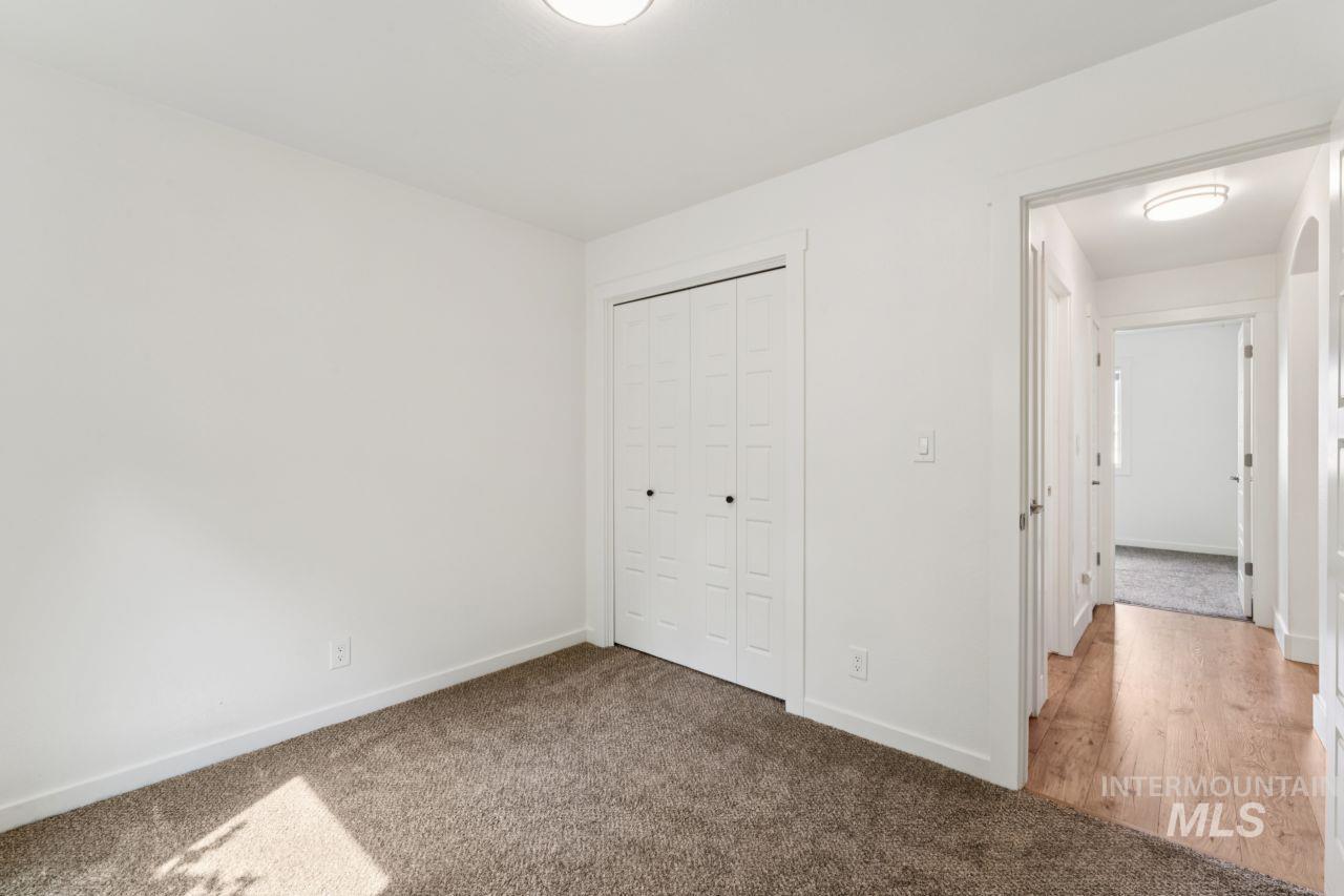 Unfurnished bedroom with carpet floors and a closet