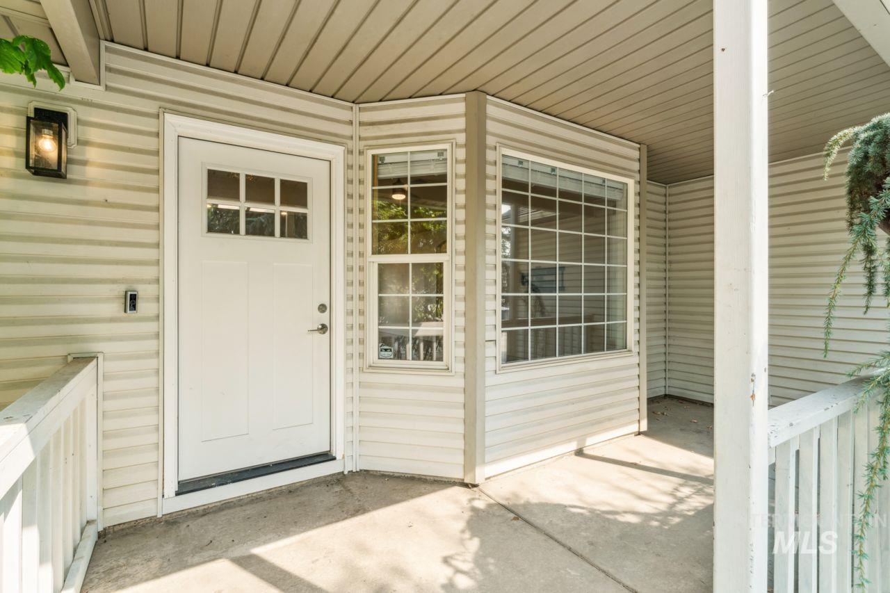 Property entrance with a patio