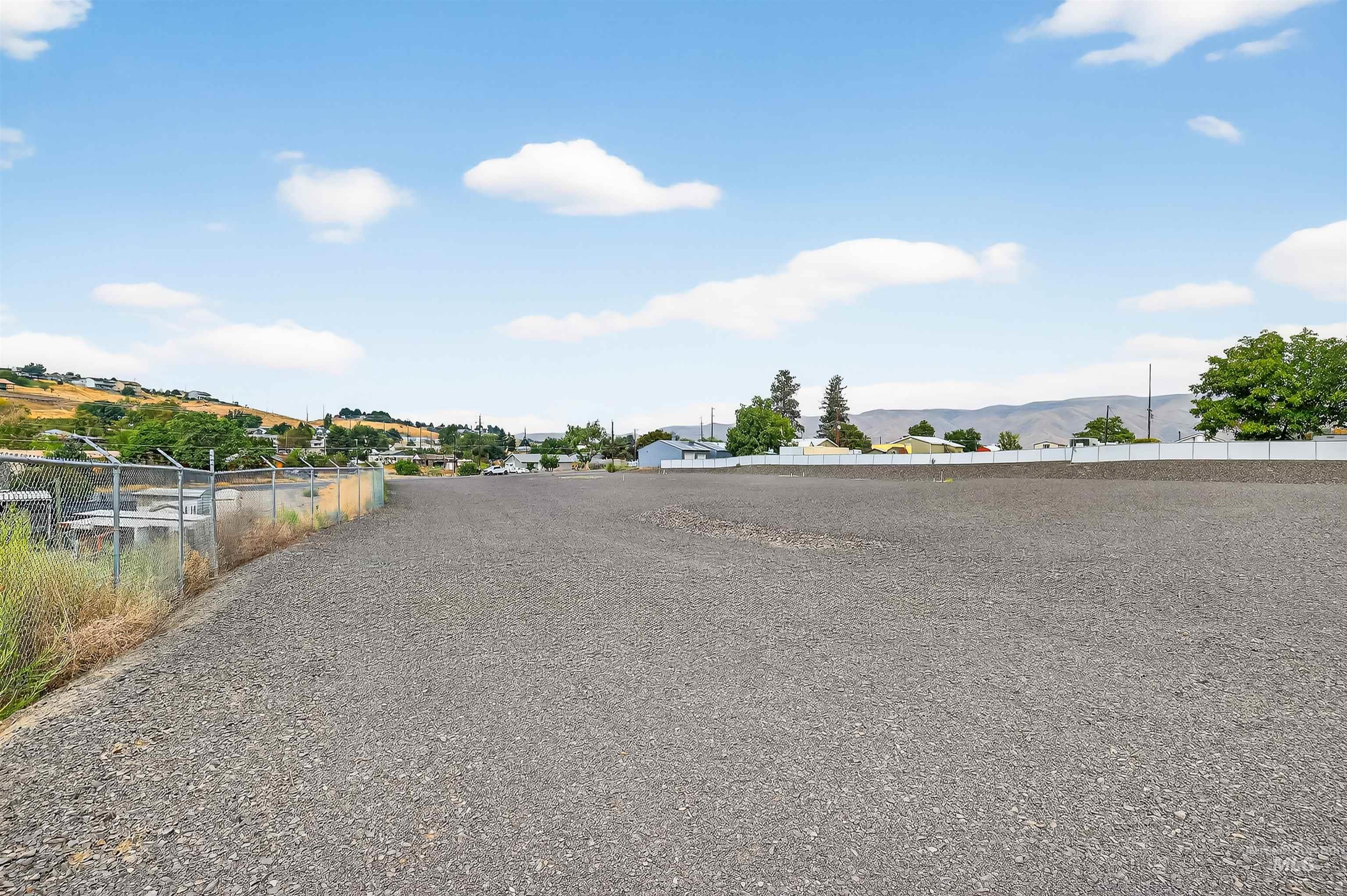 View of dirt / gravel road with a mountain view