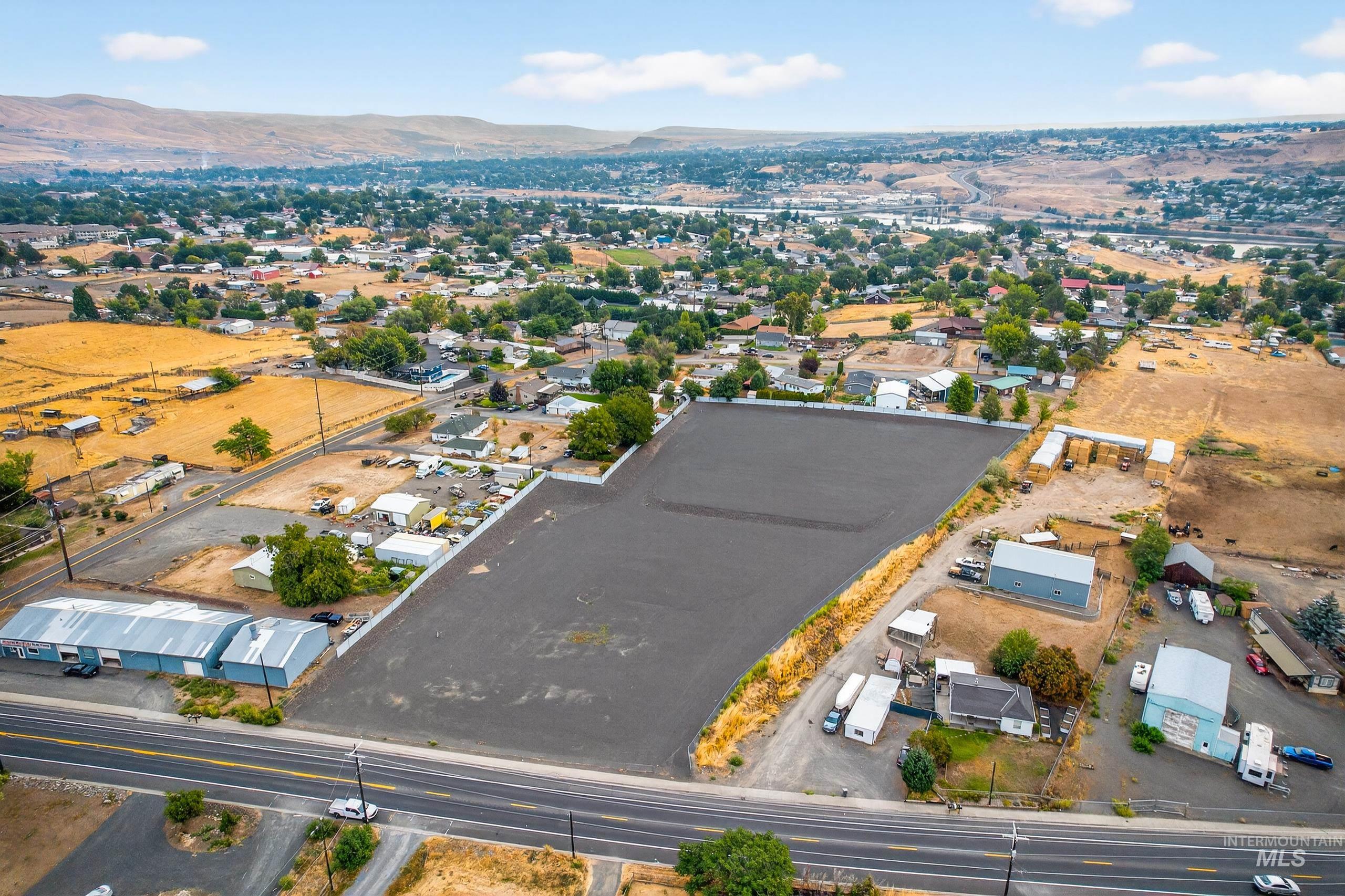 Aerial overview of property's location with a mountainous background