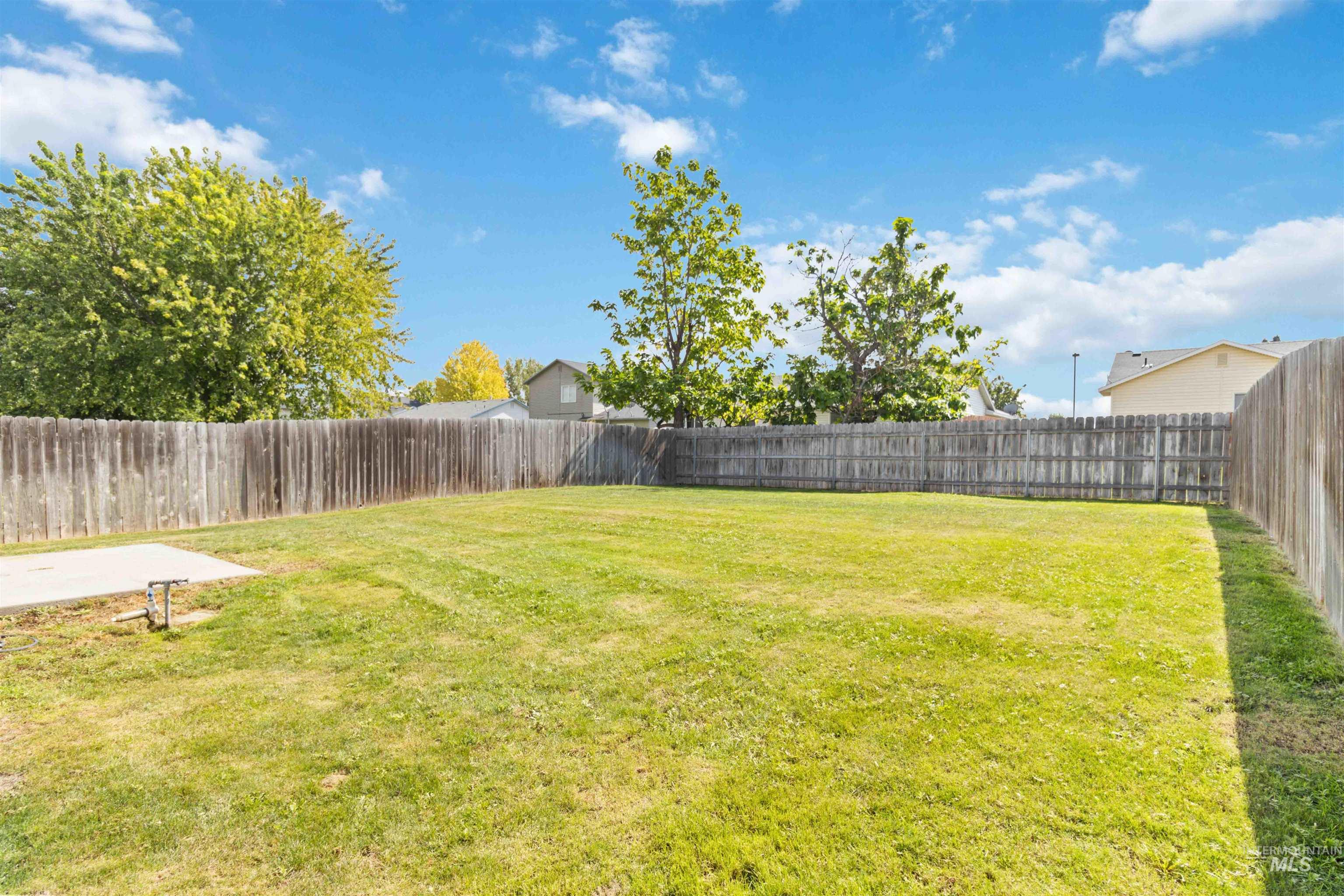 Fenced backyard featuring a patio area