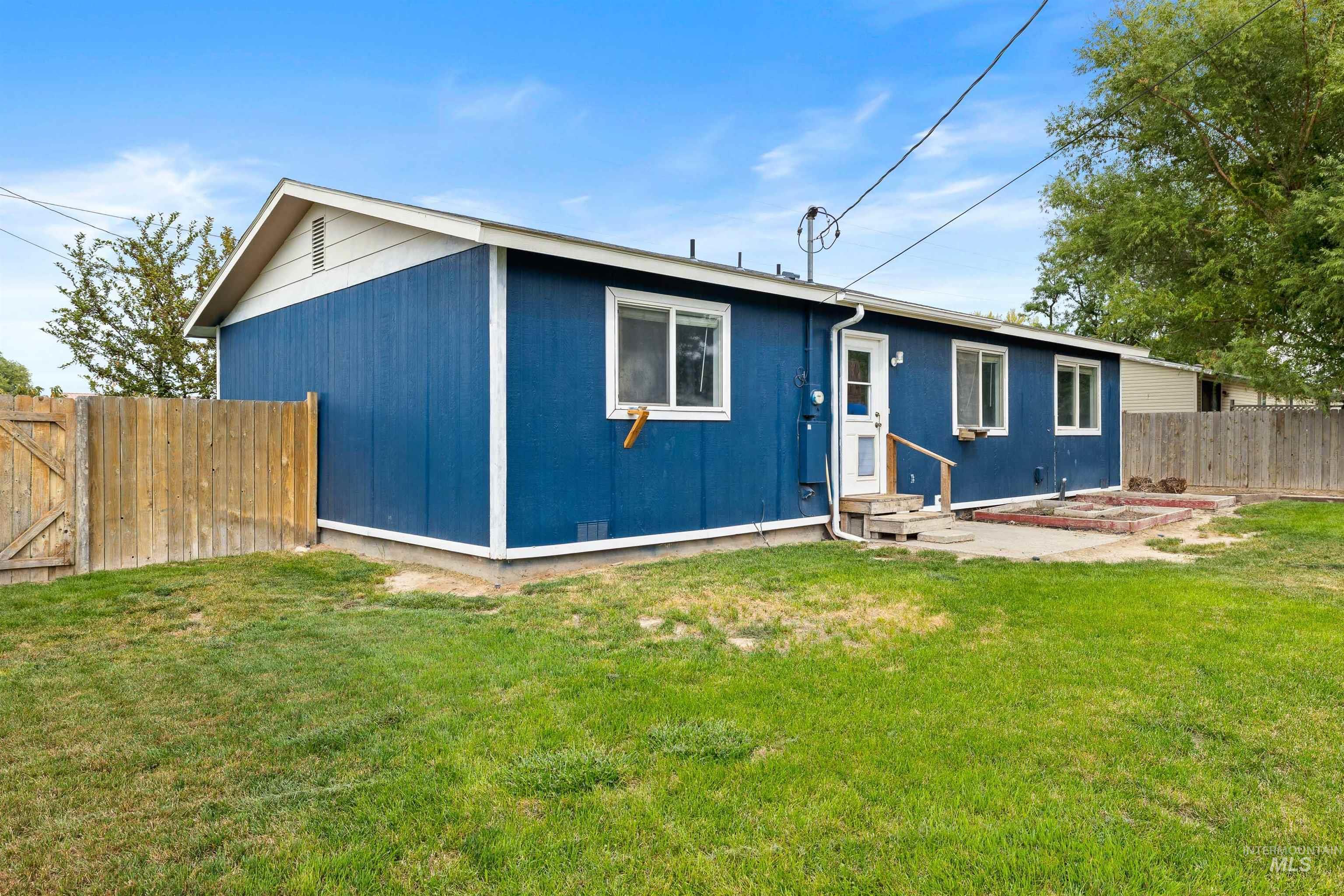 Rear view of property with a patio area and entry steps