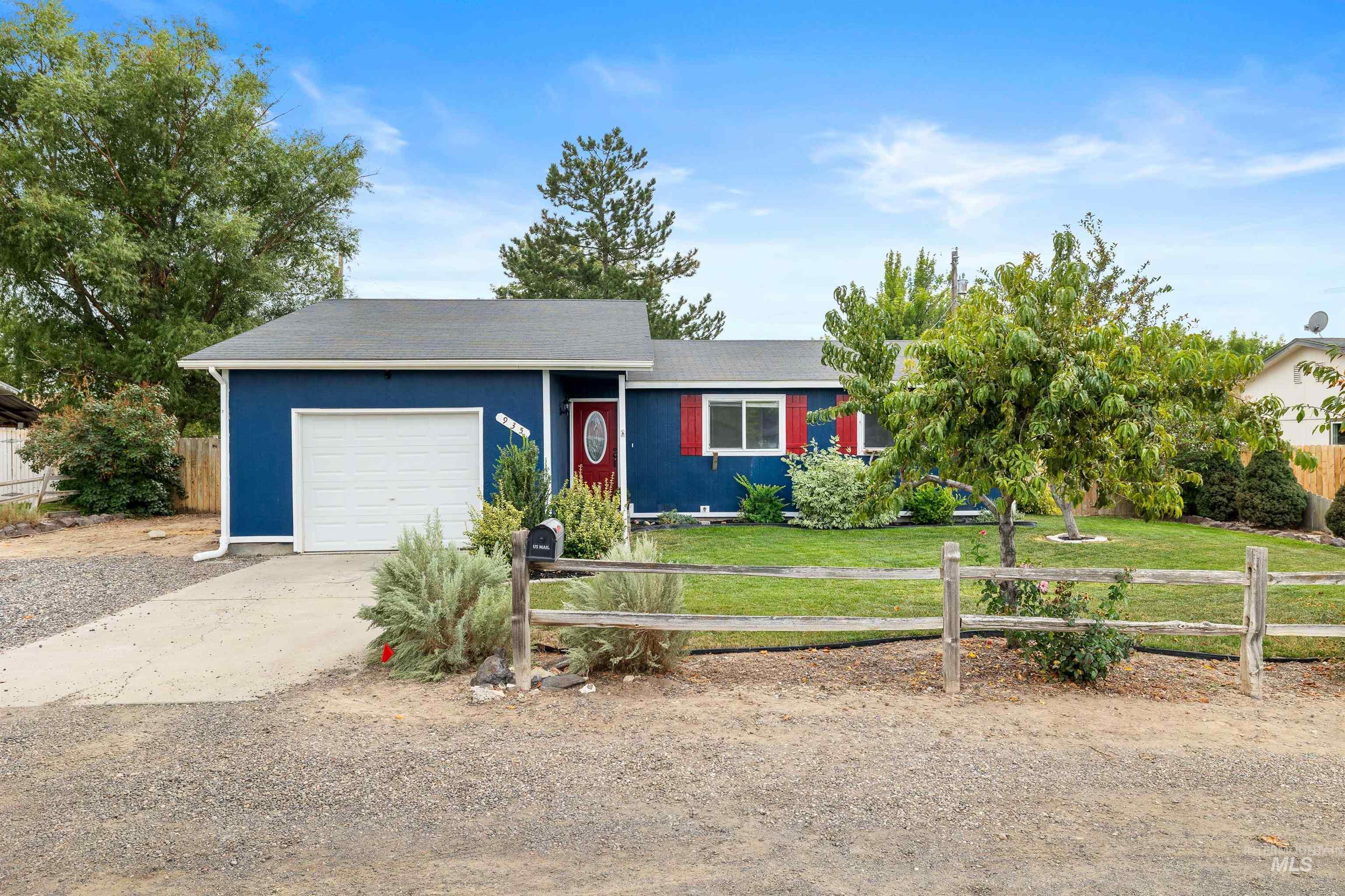 Ranch-style house with concrete driveway and a garage