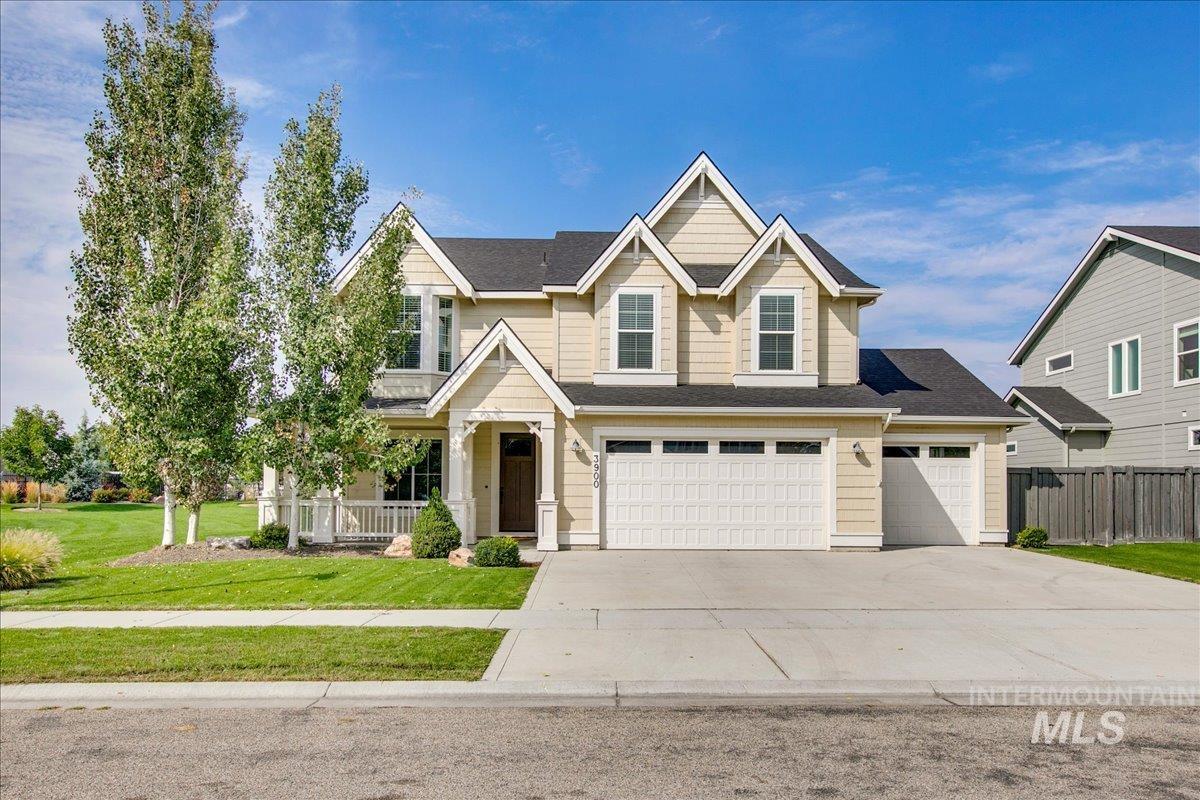 Craftsman inspired home with a porch, concrete driveway, a shingled roof, and an attached garage