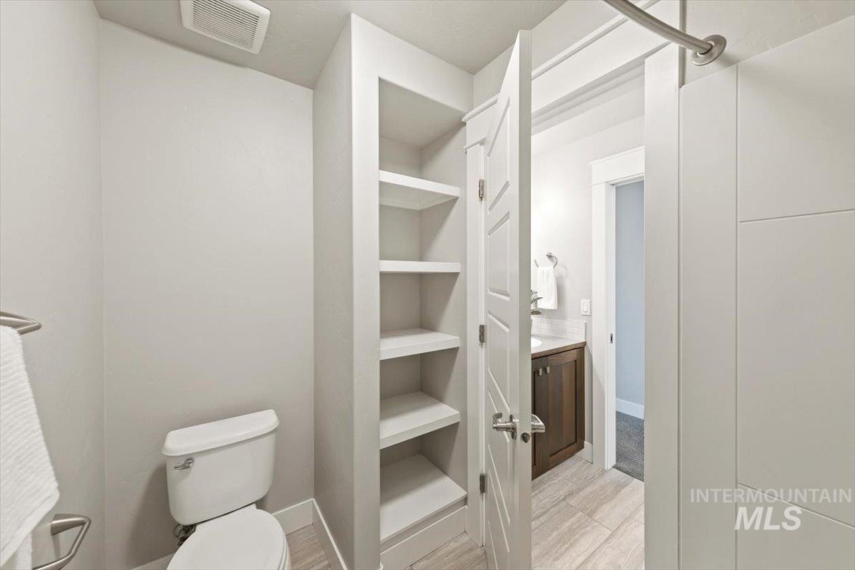 Bathroom featuring vanity and light wood-style floors
