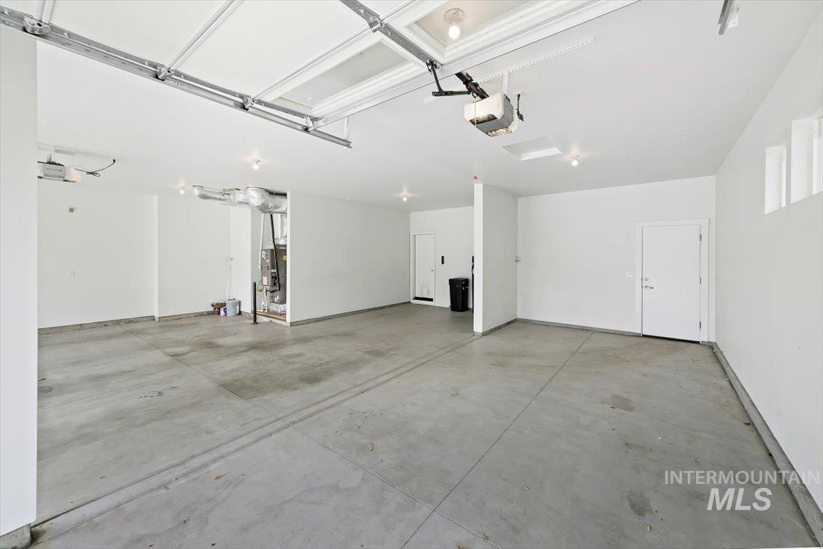 Garage featuring a garage door opener