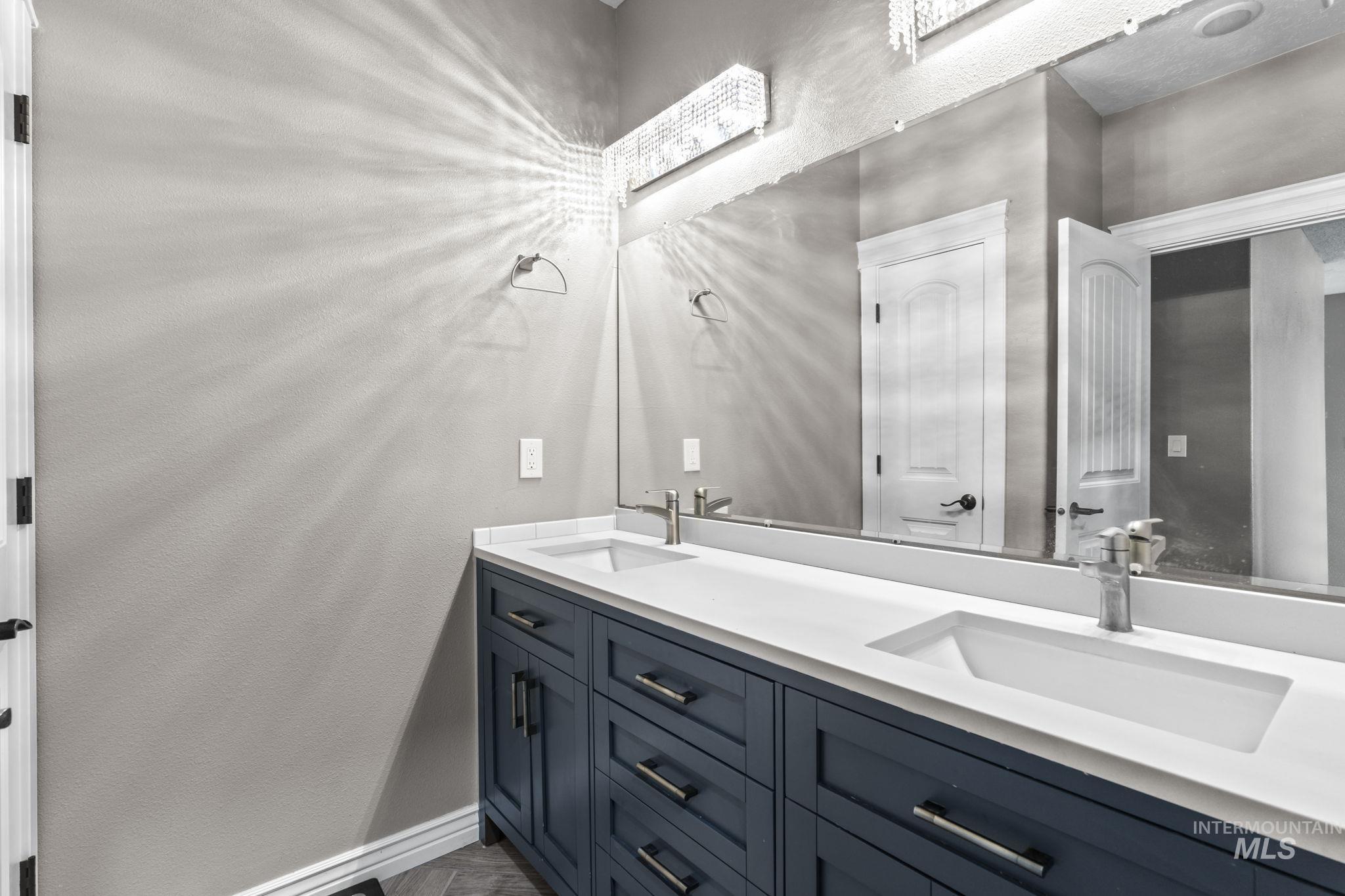 Full bath featuring double vanity