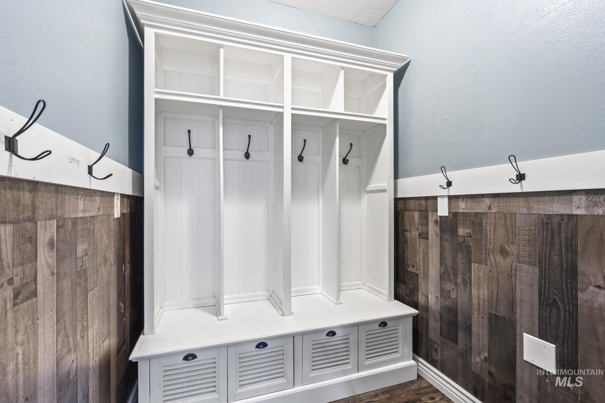 Mudroom with dark wood-type flooring