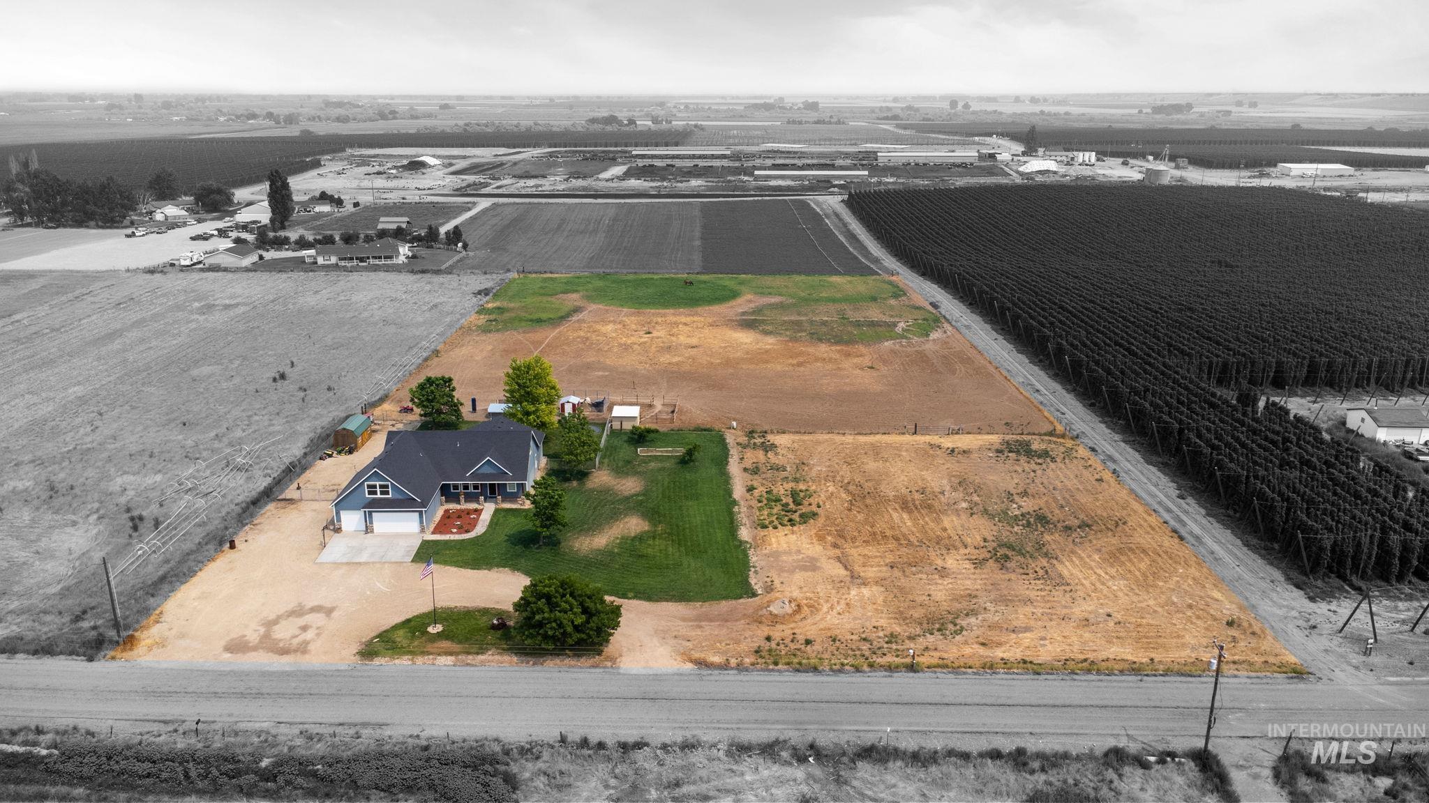 Aerial view of sparsely populated area featuring abundant farmland