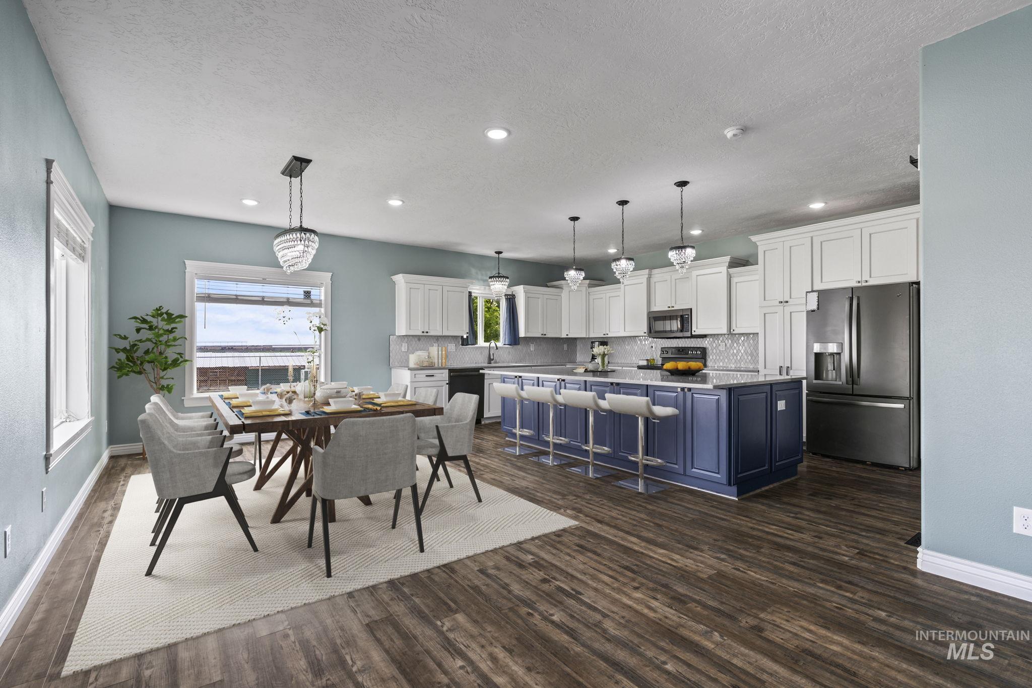 Dining area with dark wood-style flooring, recessed lighting, and a textured ceiling