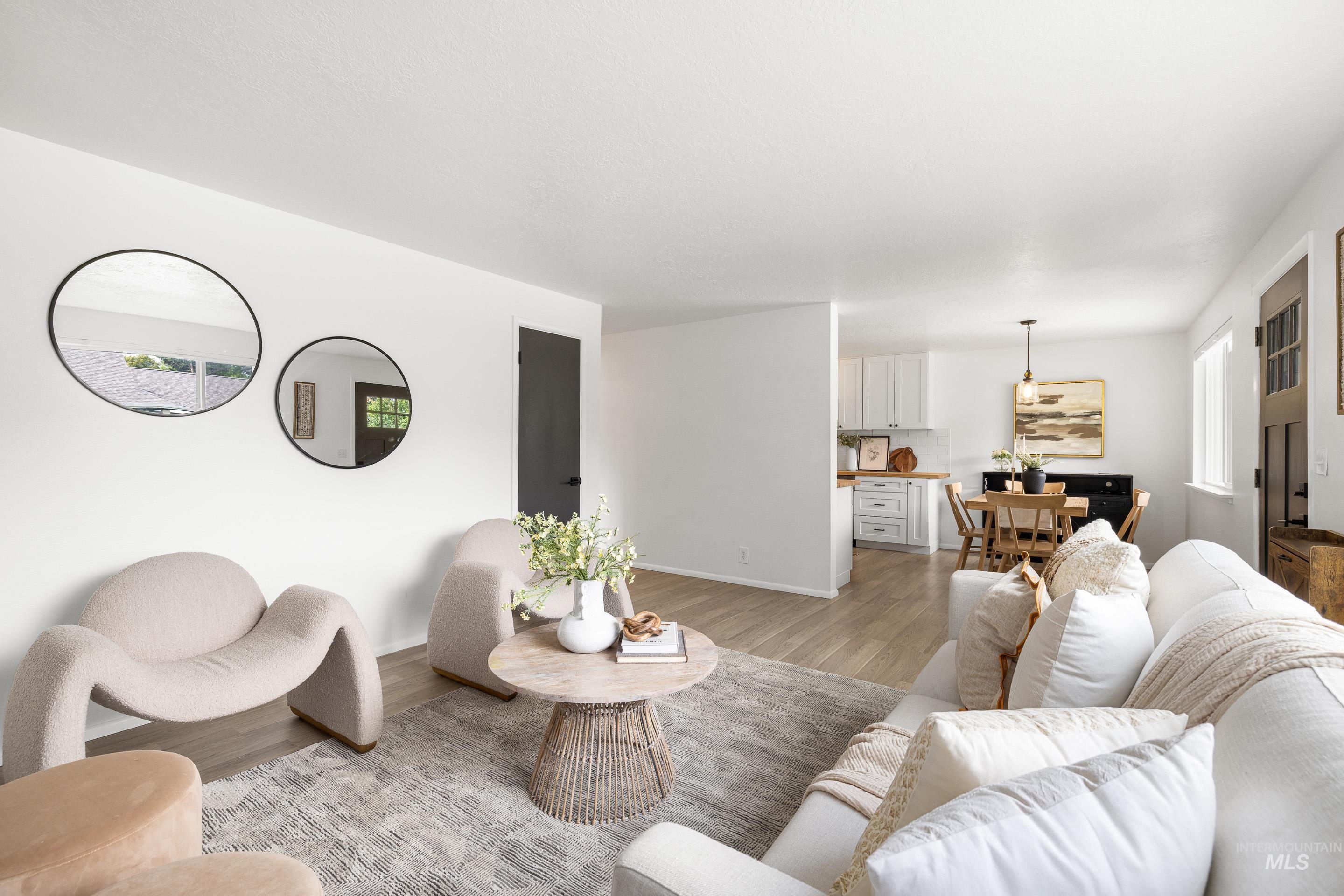 Living room featuring plenty of natural light and light wood-style flooring