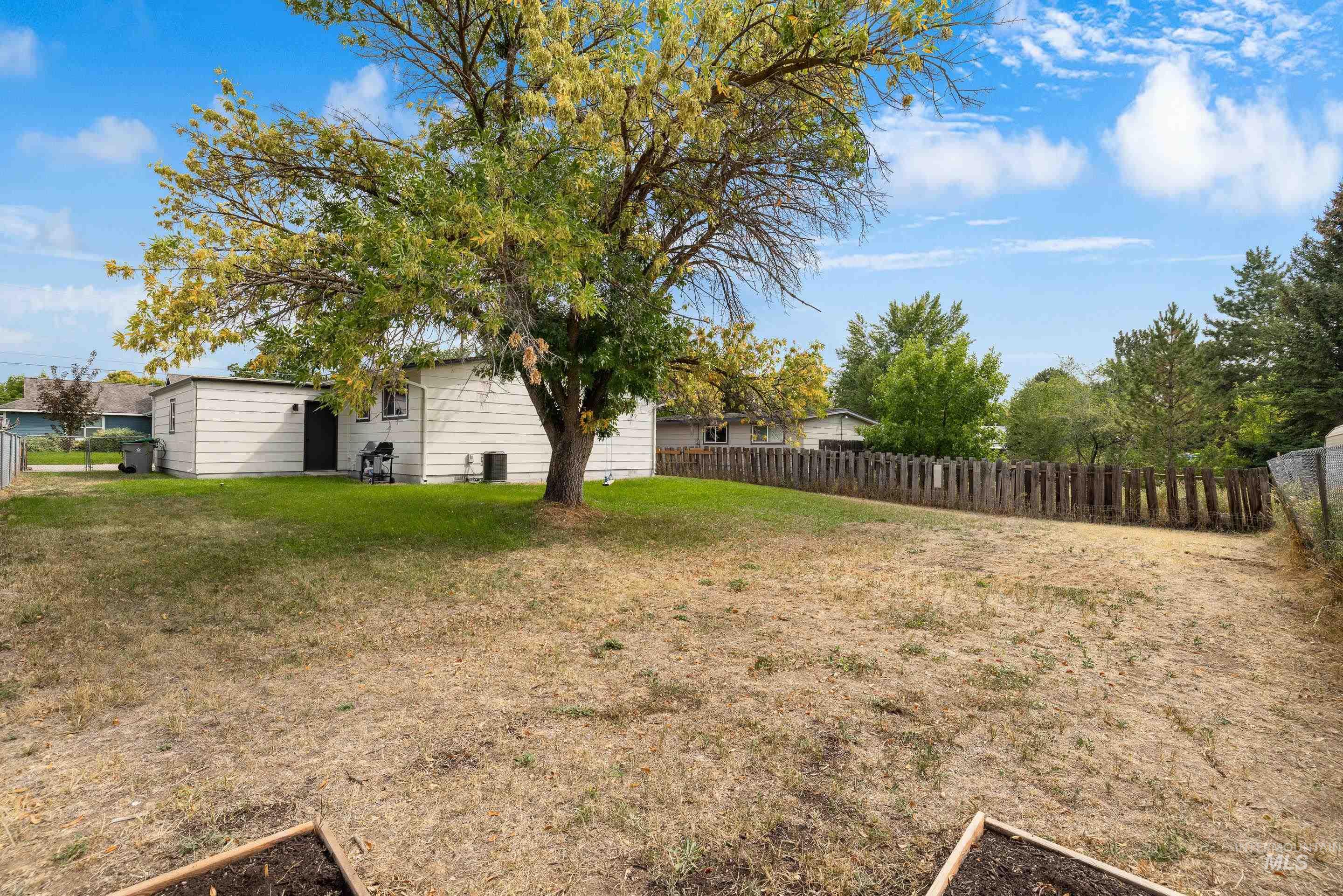 View of fenced backyard