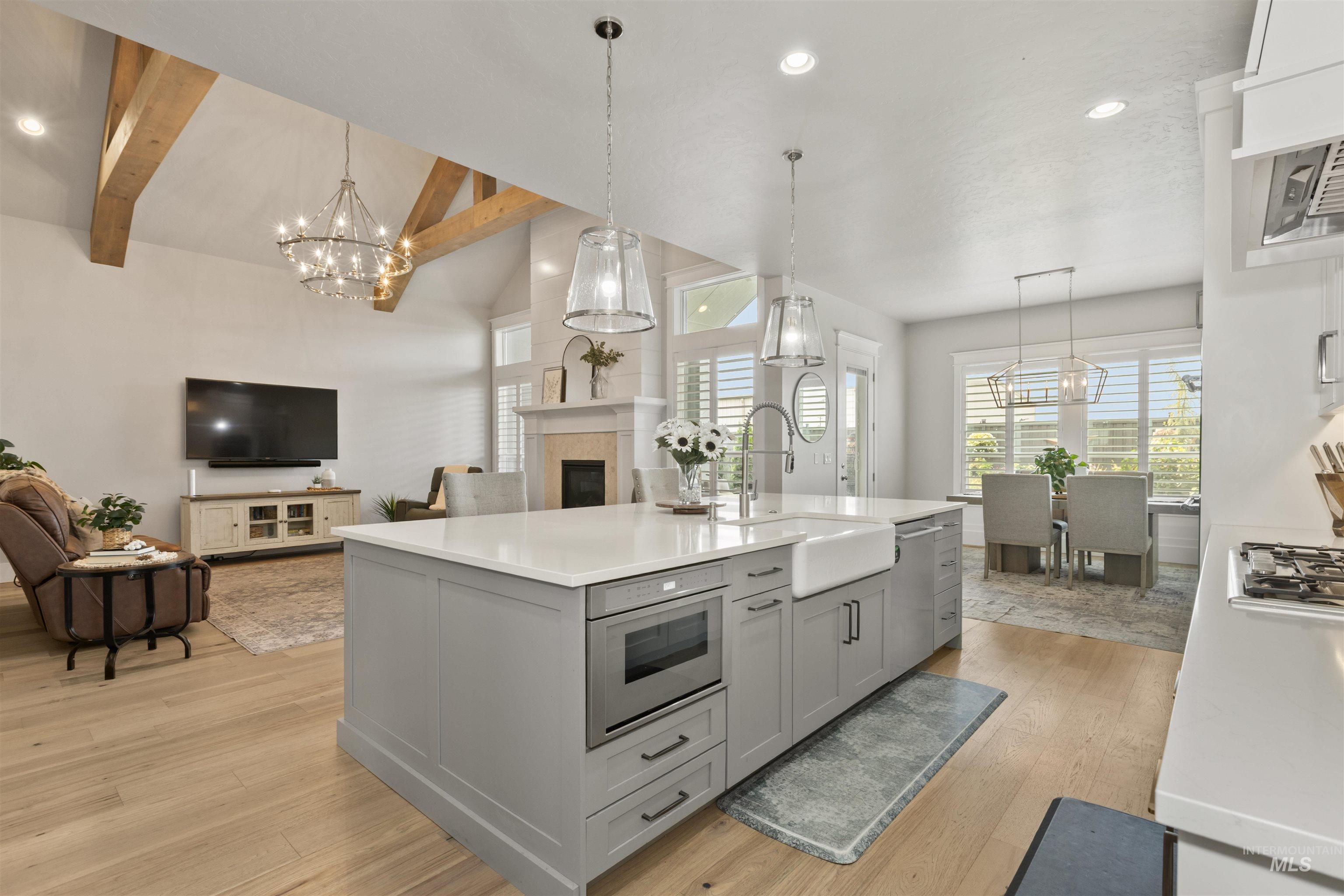 Kitchen with a chandelier, recessed lighting, decorative light fixtures, and open floor plan