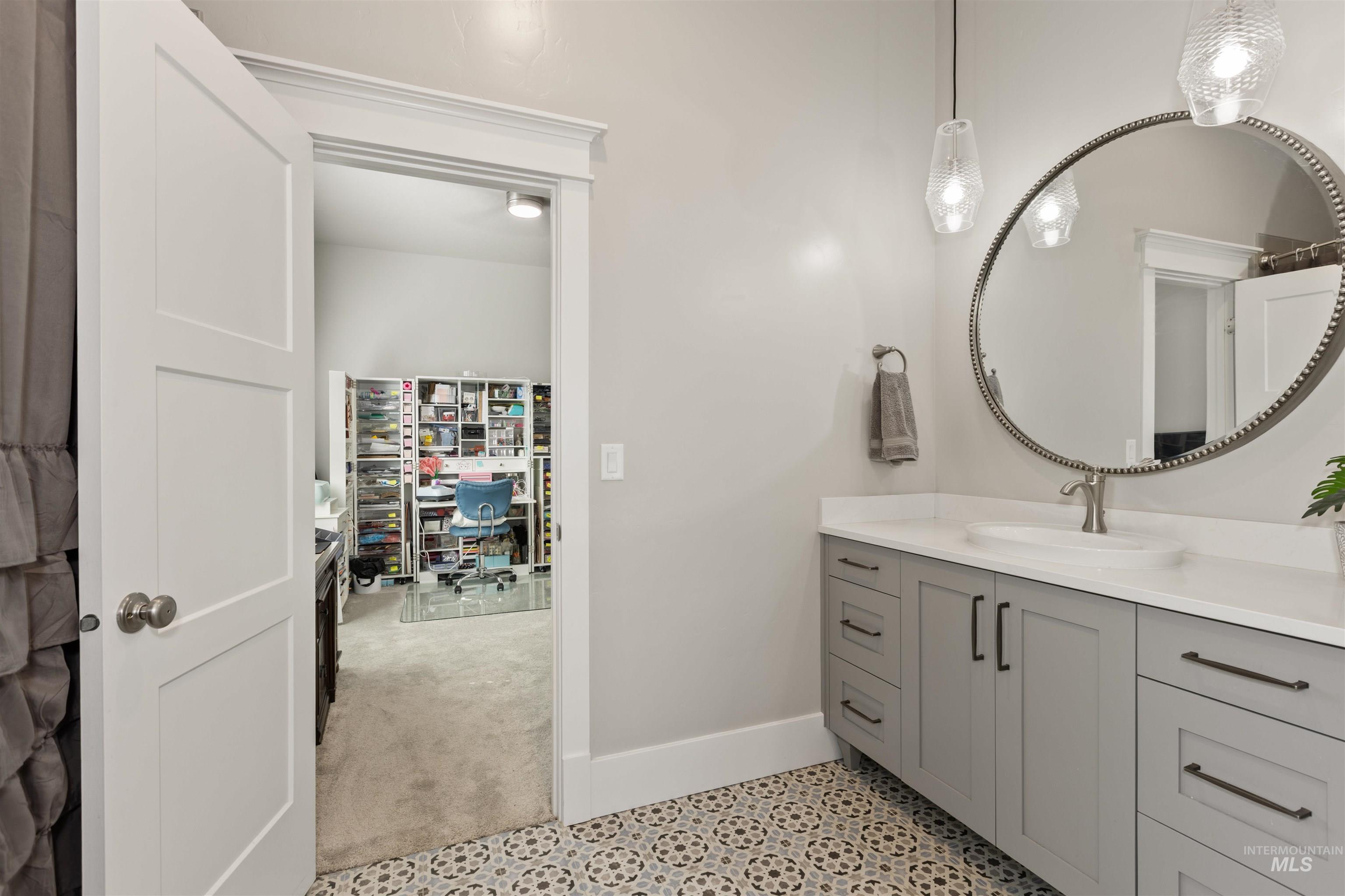 Bathroom with vanity and baseboards