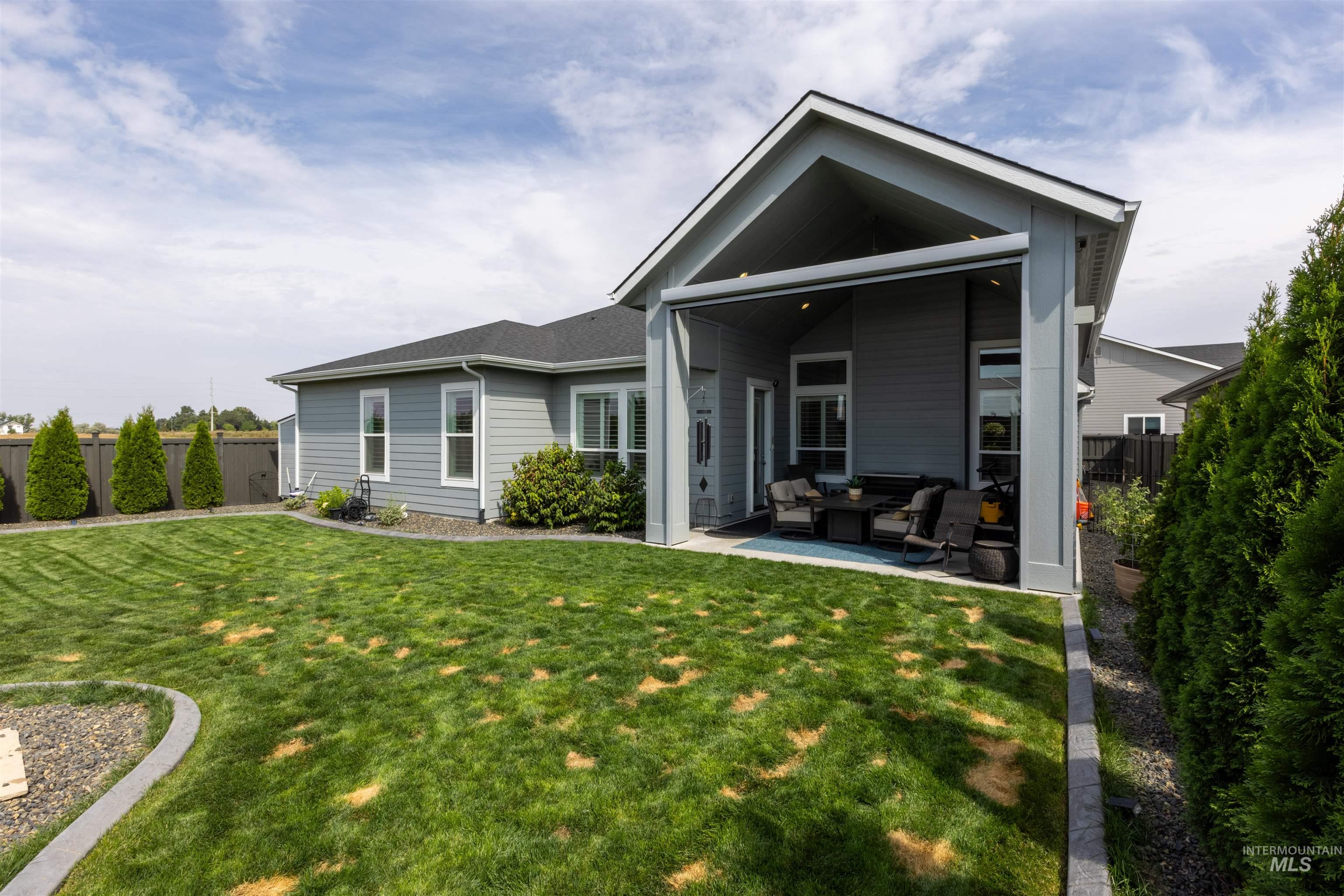 Back of property with a patio area and outdoor lounge area