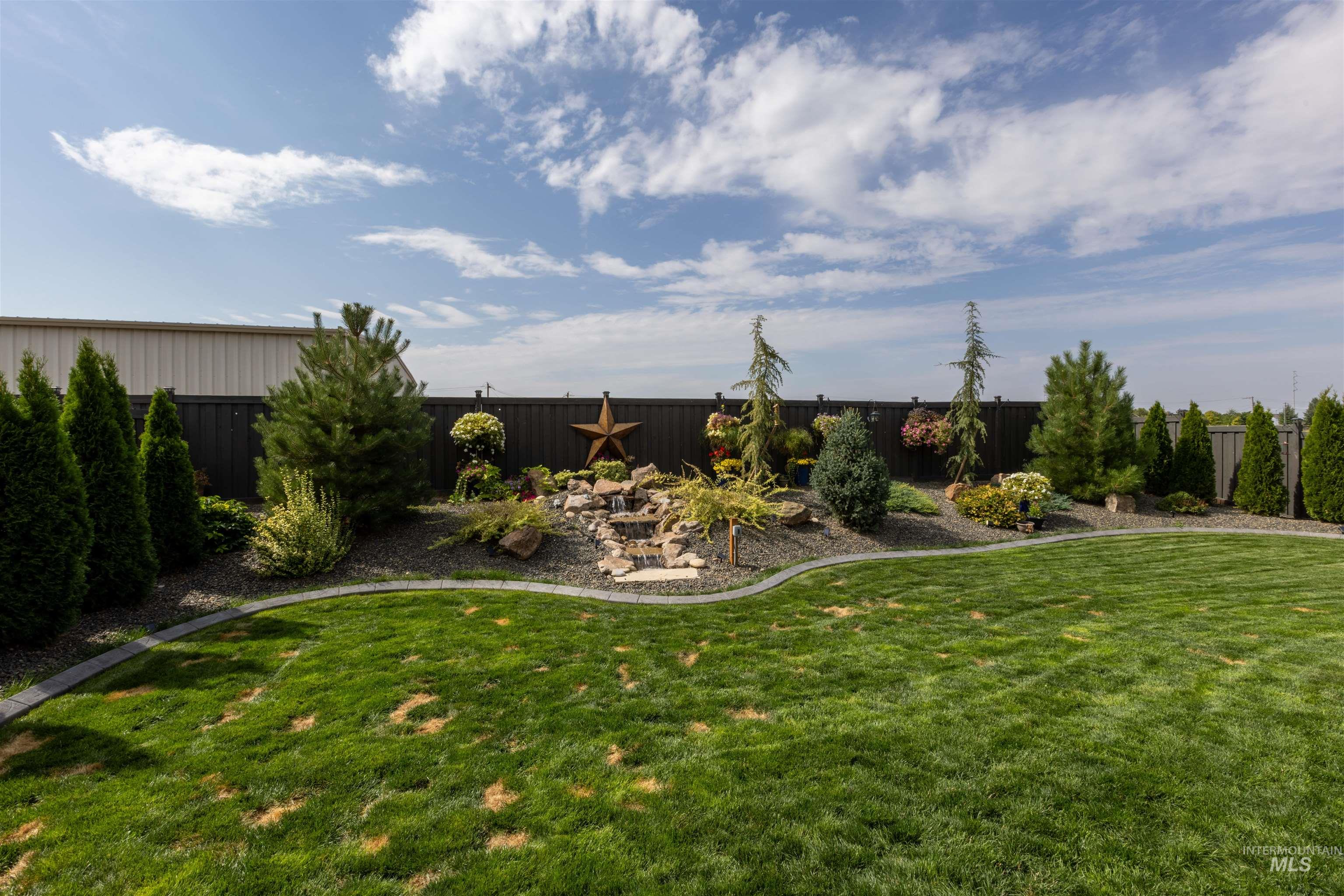 View of fenced backyard