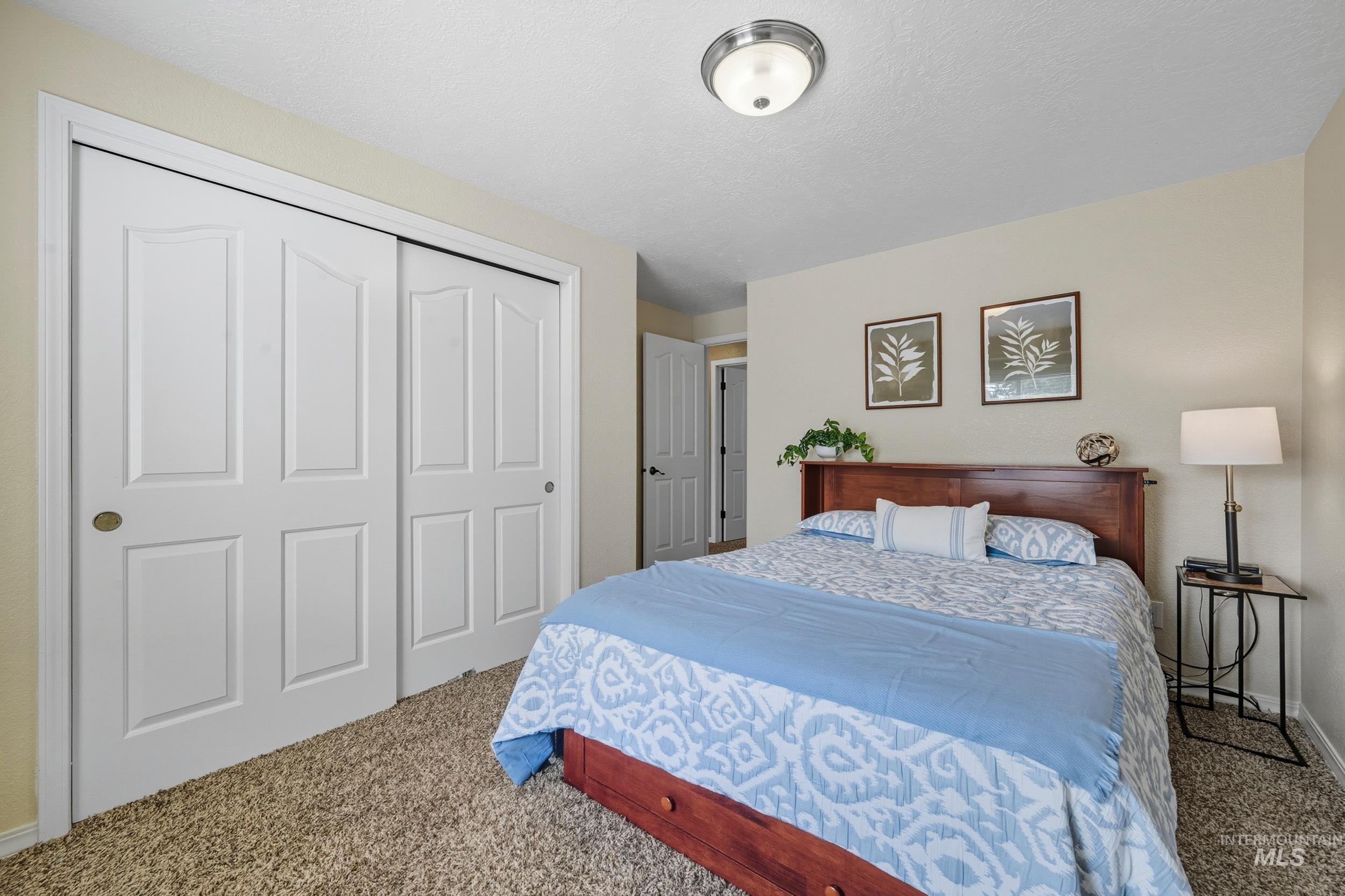 Bedroom with carpet floors and a closet