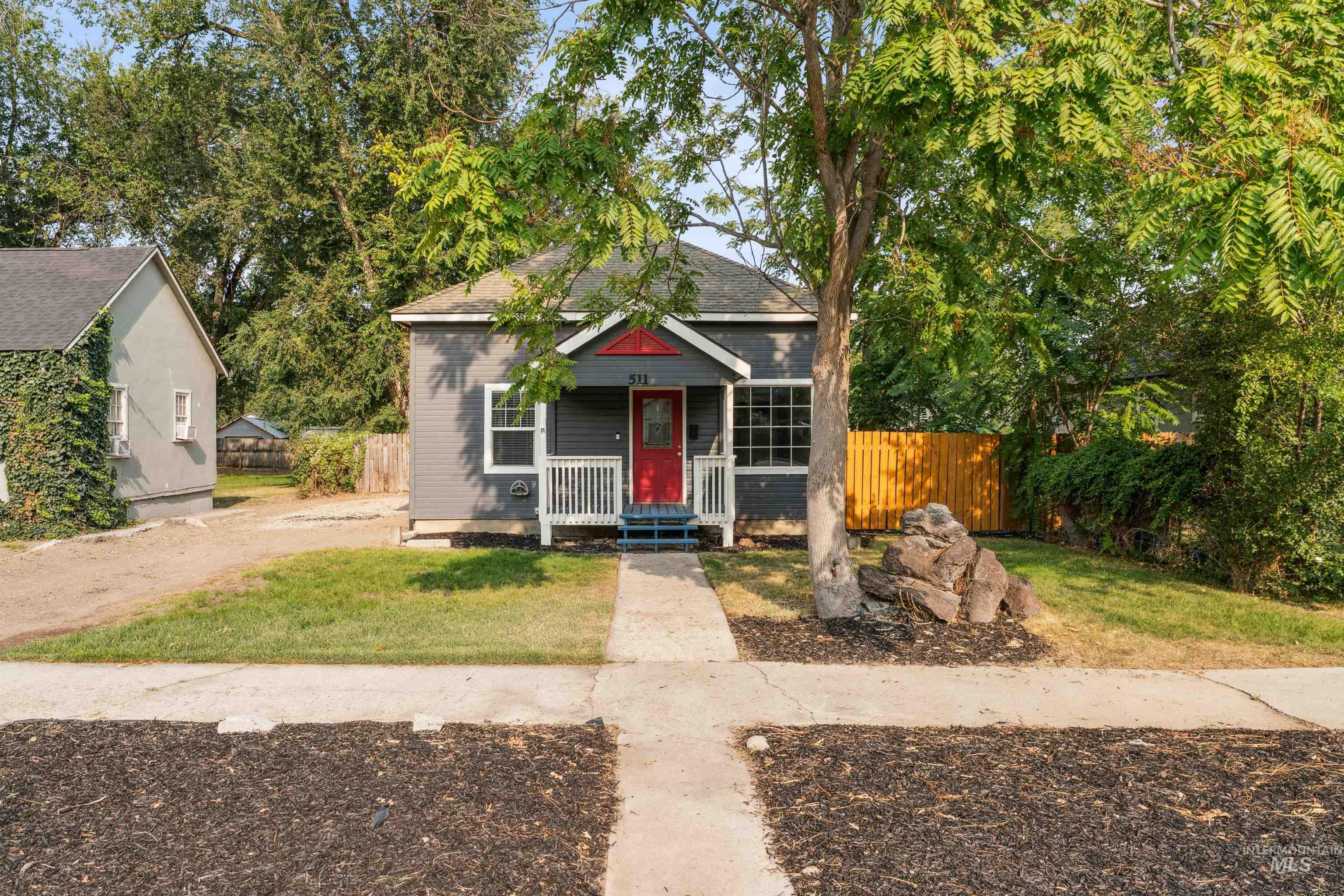 Bungalow-style home featuring a porch and a shingled roof