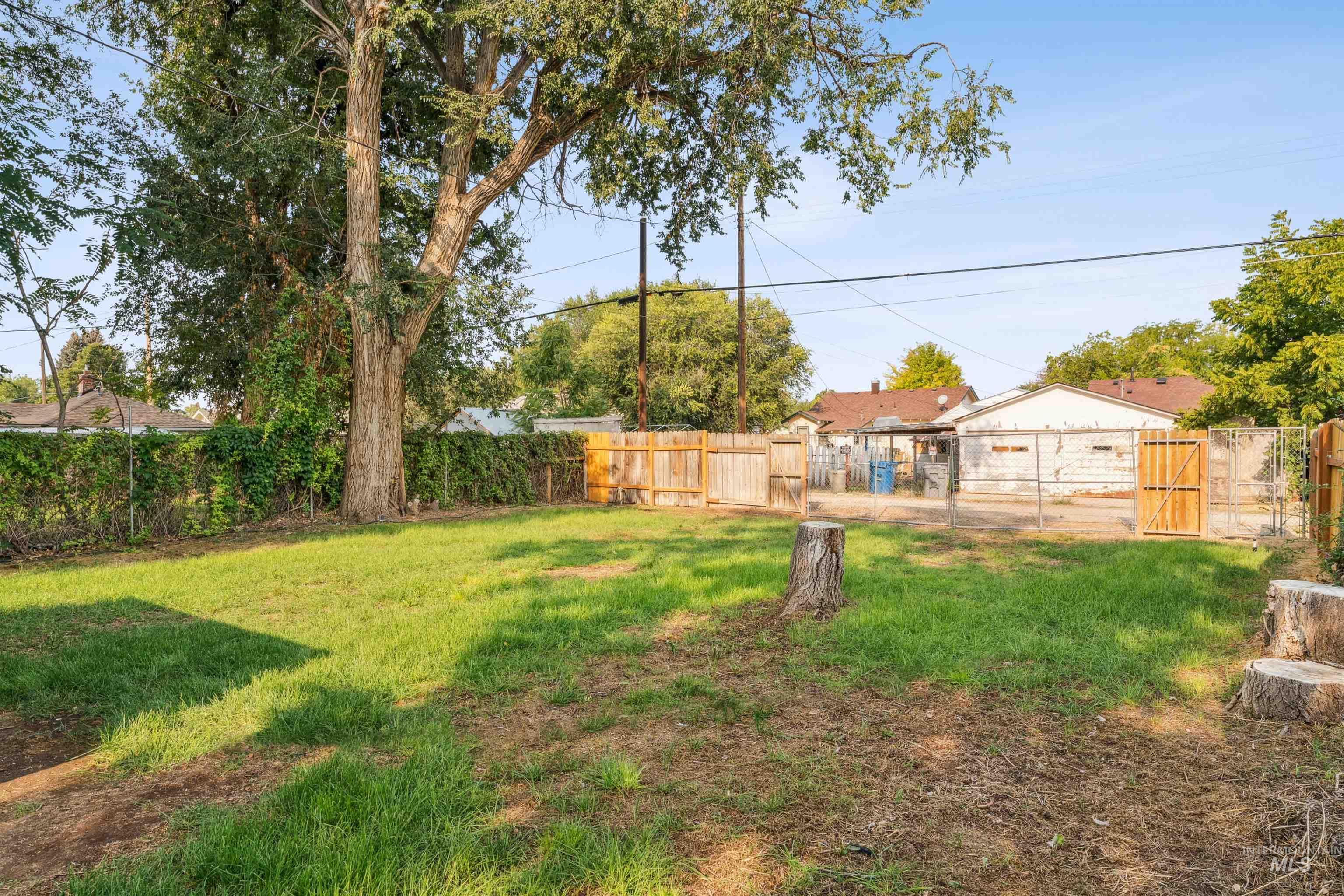 Fenced backyard with a gate