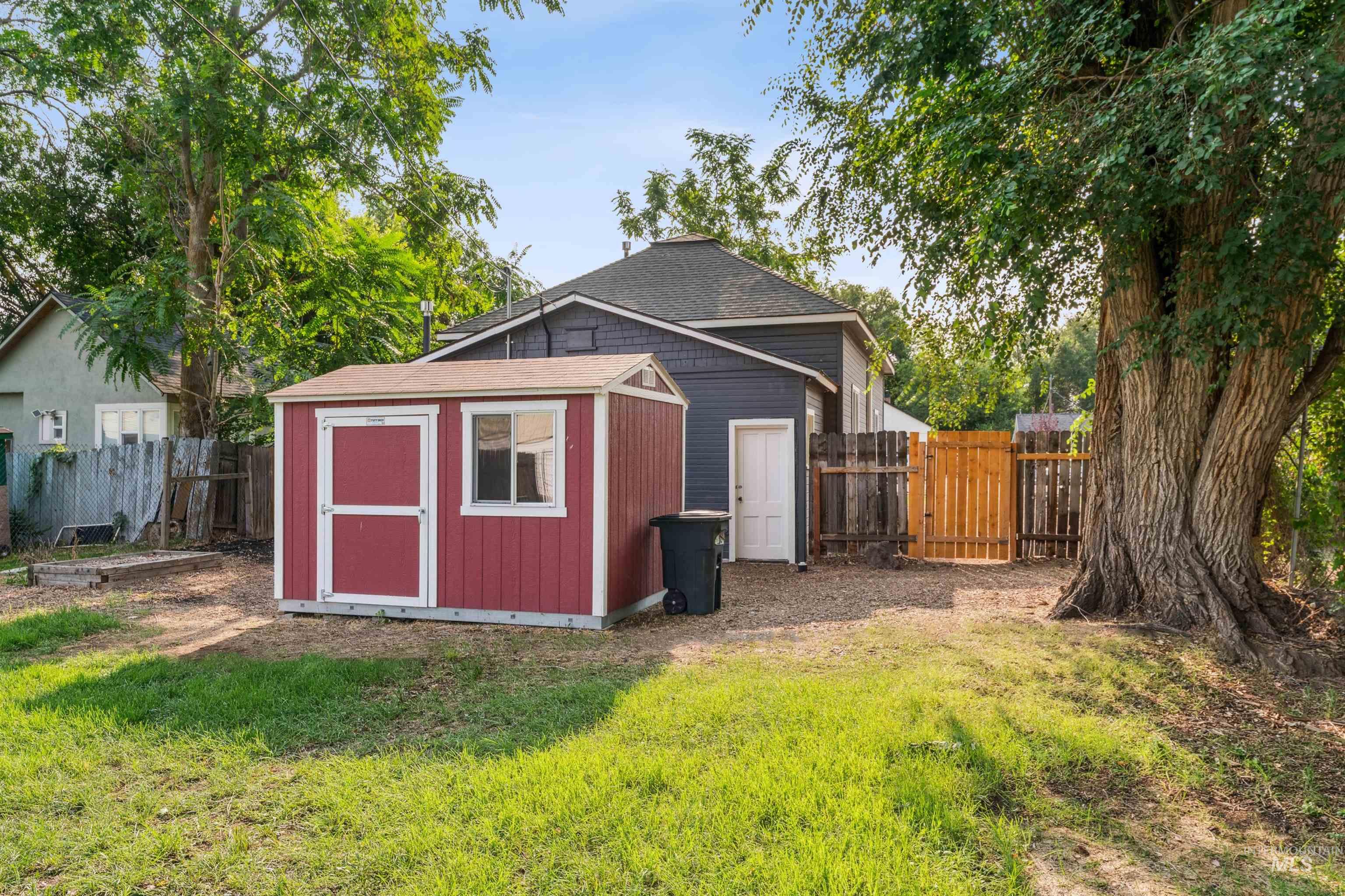 View of shed with a fenced backyard