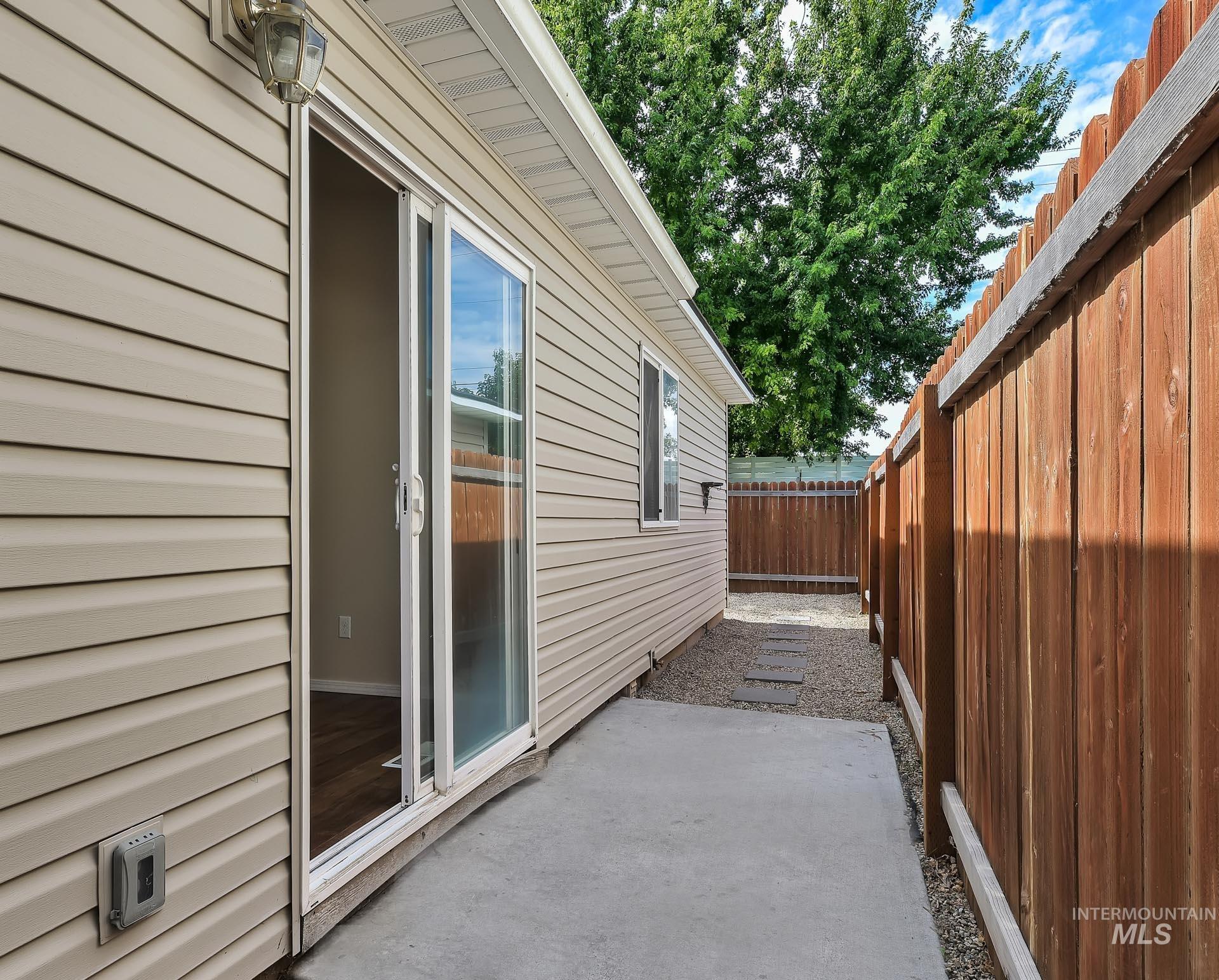 View of side of home with a patio area