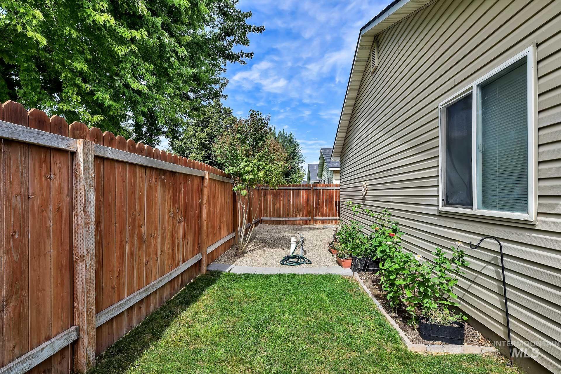 Fenced backyard featuring a patio area