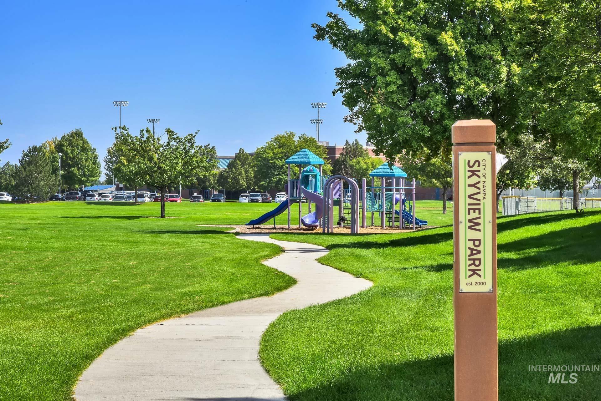Community playground featuring a lawn